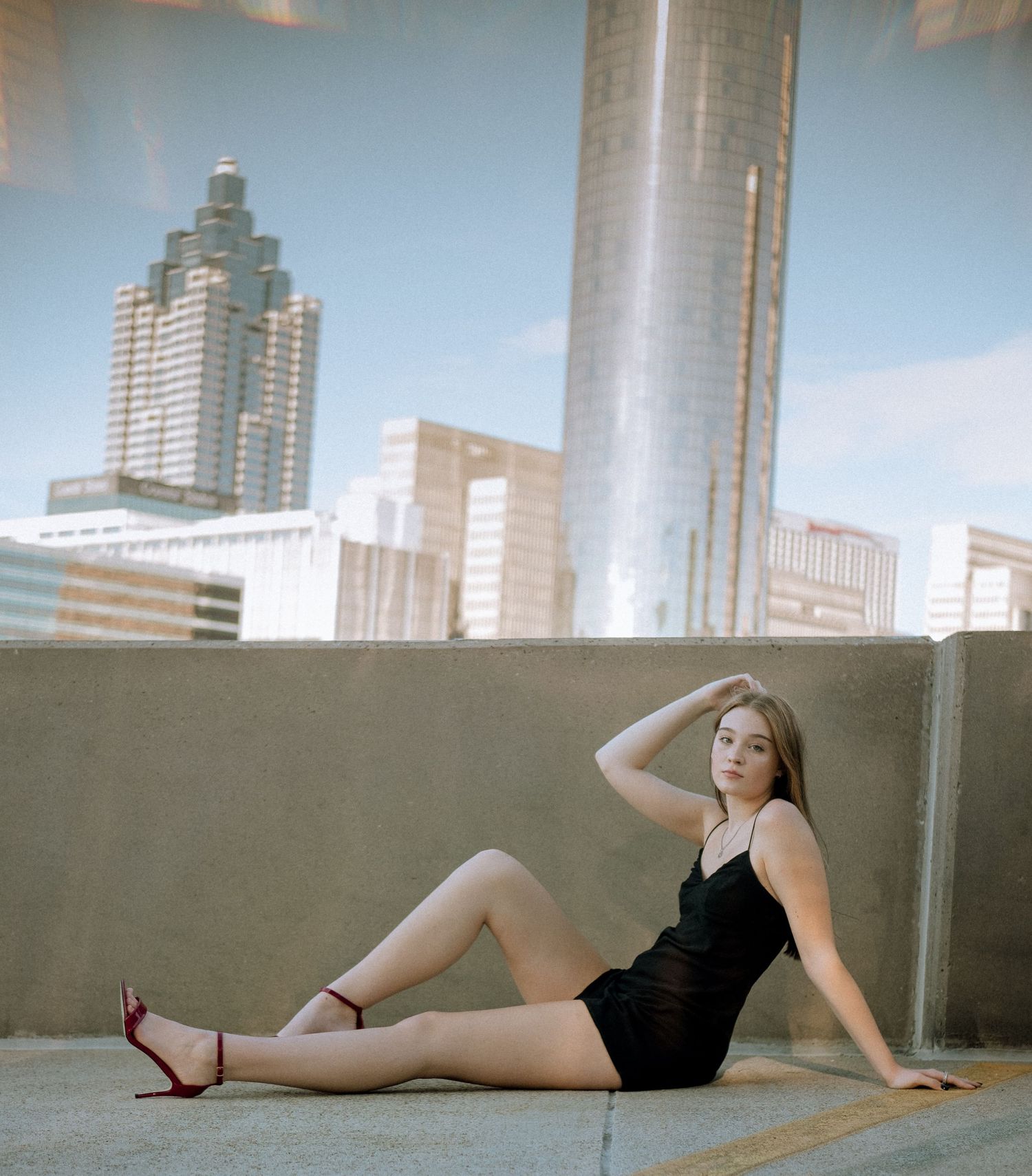 Photo of a high school senior with the Atlanta skyline