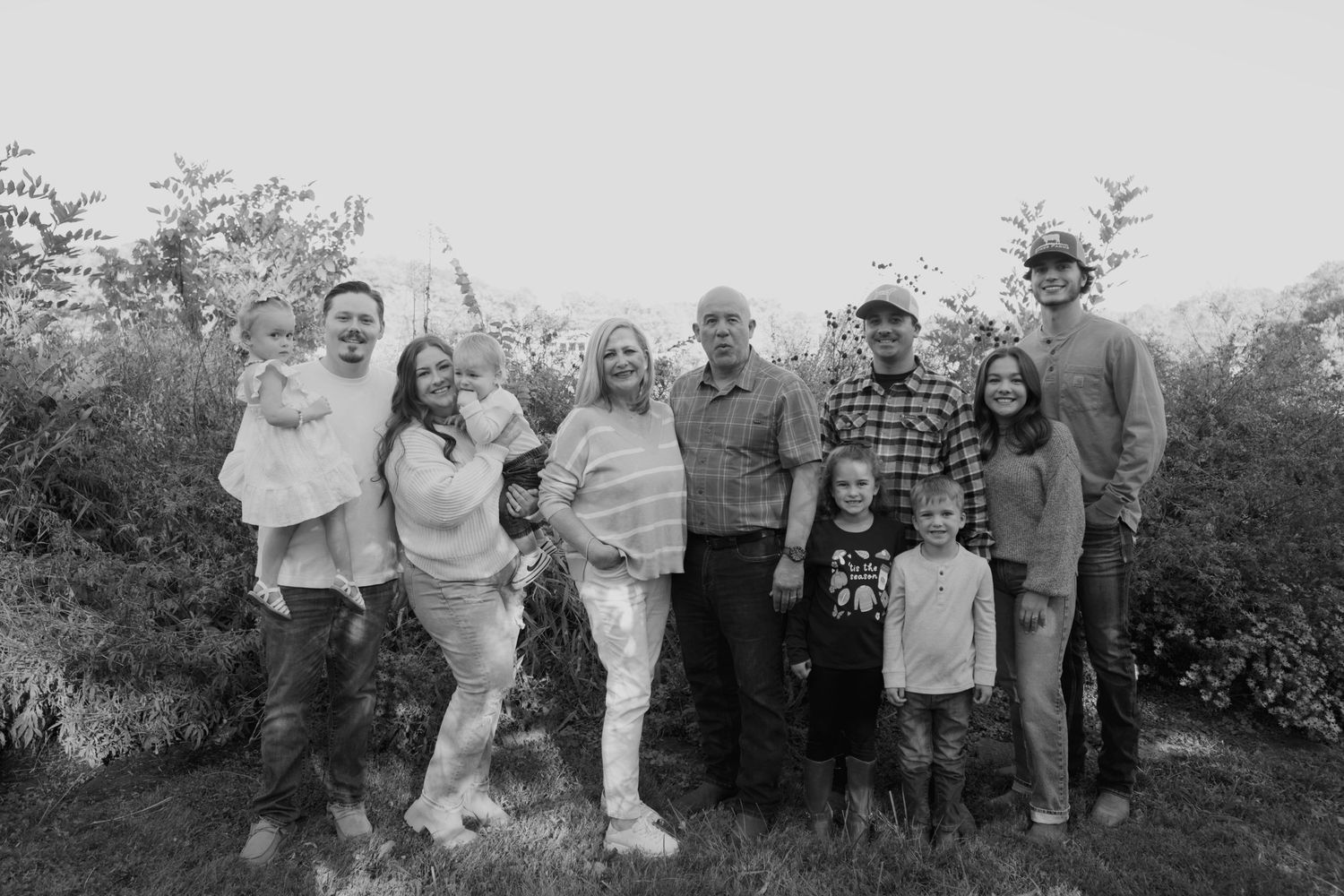 A collection of vintage black and white photographs showing people gathered outdoors in casual settings.