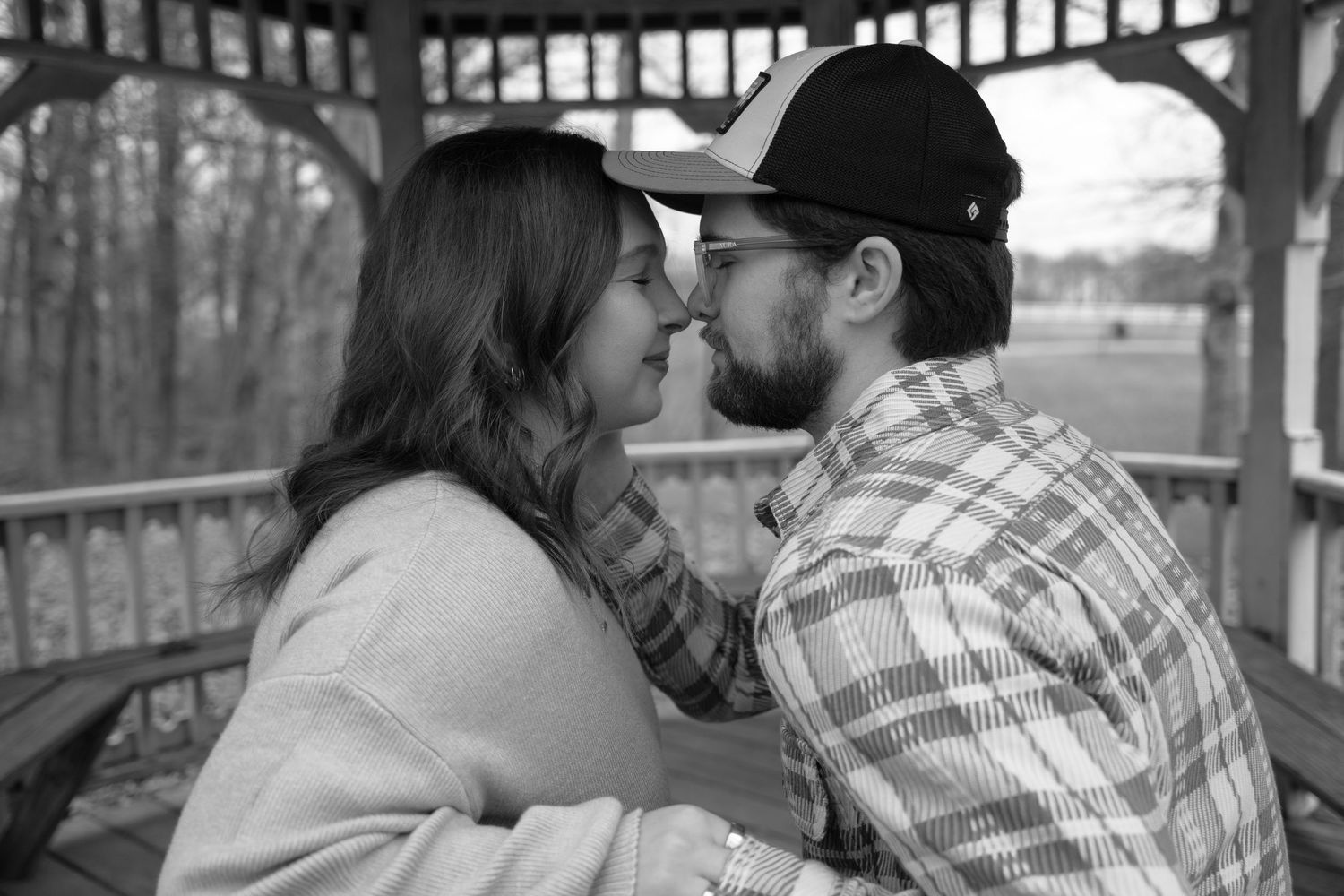 A black and white collage of romantic couples sharing tender kisses in various outdoor settings.