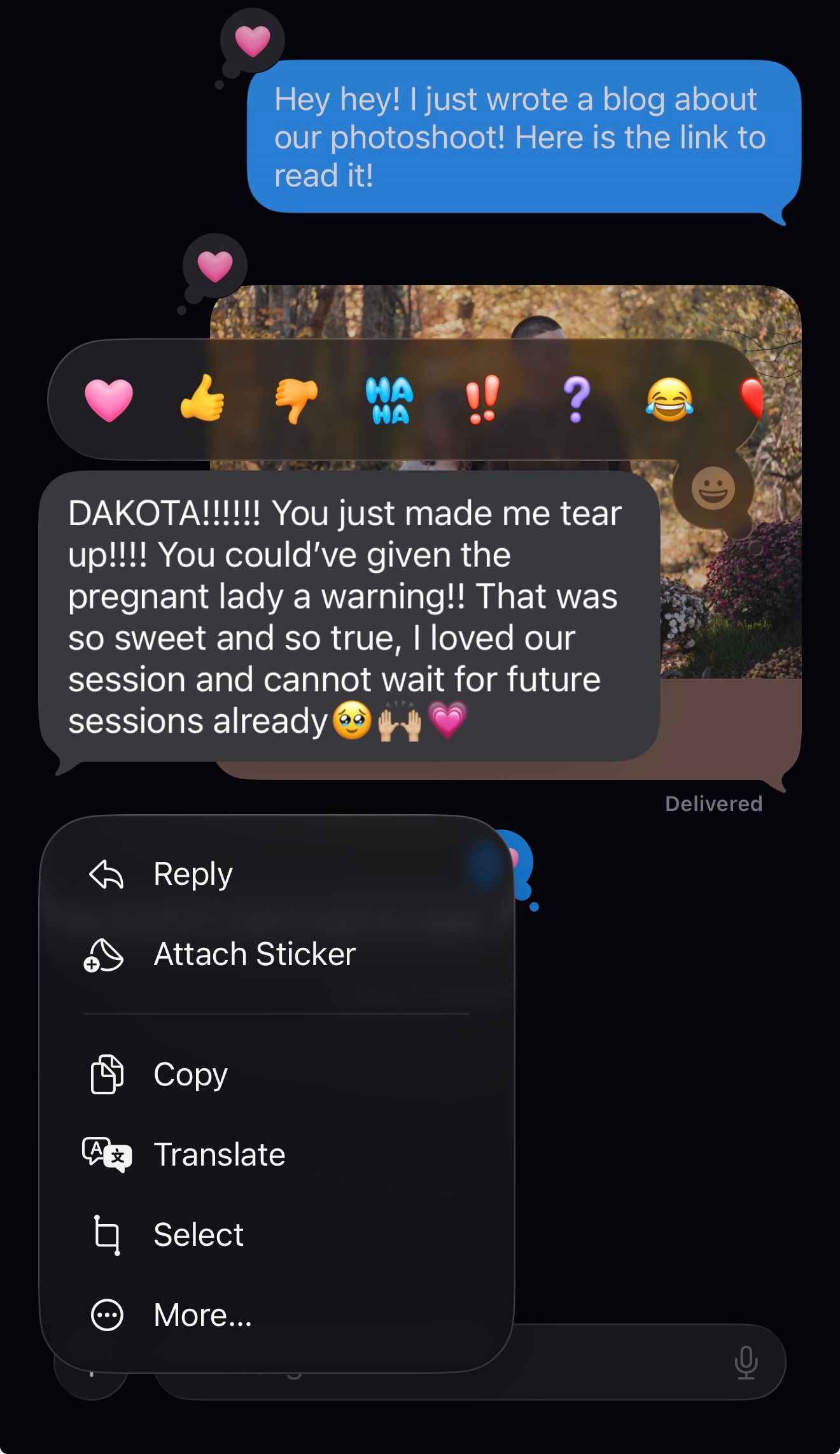 A series of text message bubbles showing an emotional conversation with heart emojis and reactions on a dark background.