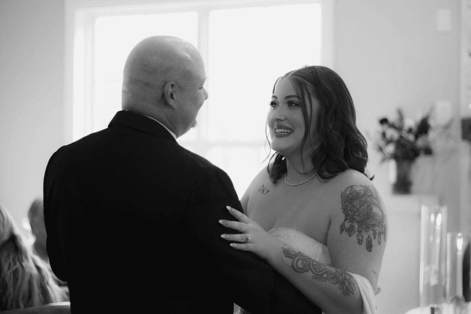 Intimate black and white wedding dance photos showing tender moments between couple.