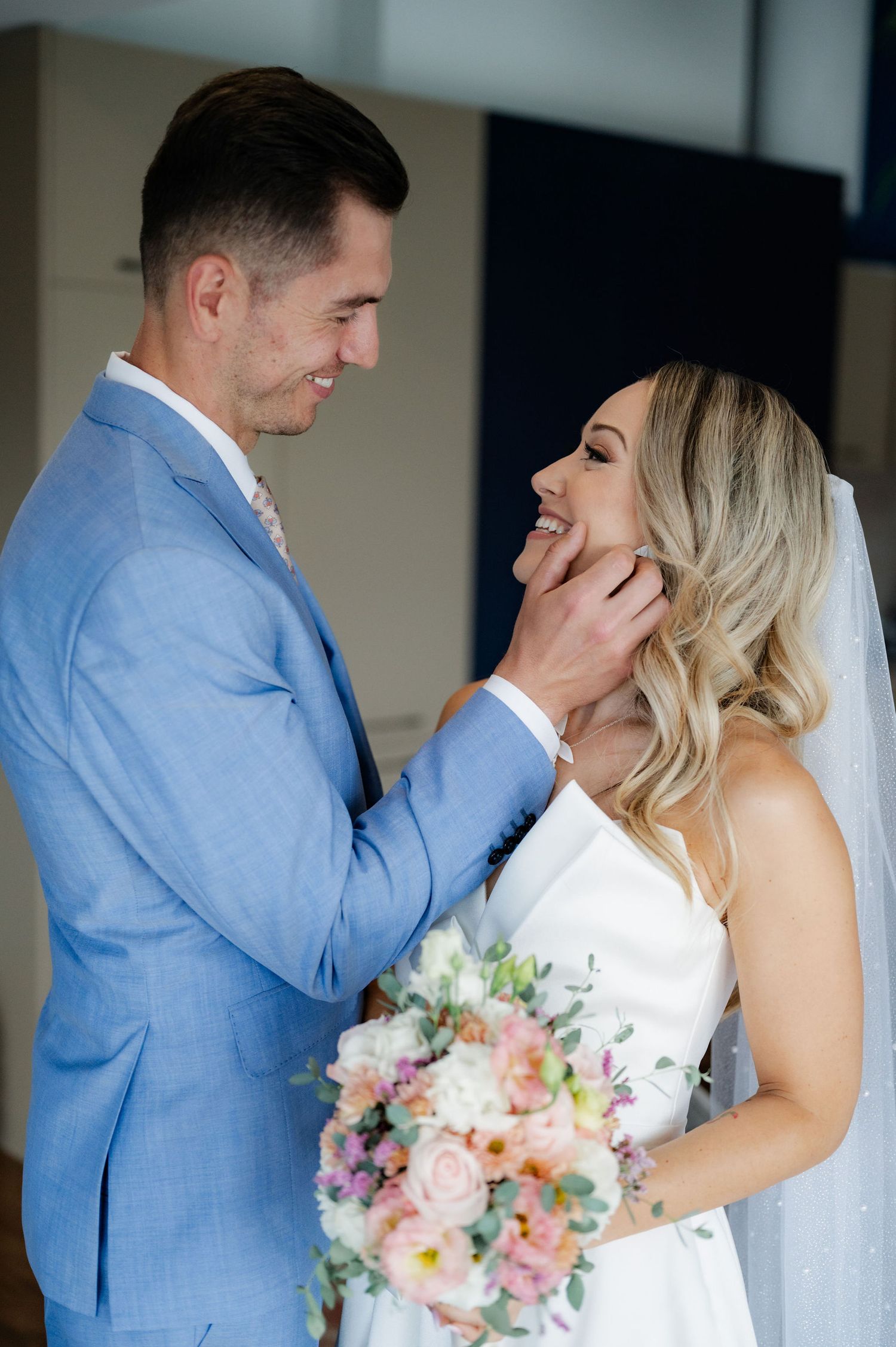 A romantic wedding moment captured in a series of intimate photographs showing a couple in blue and white attire.