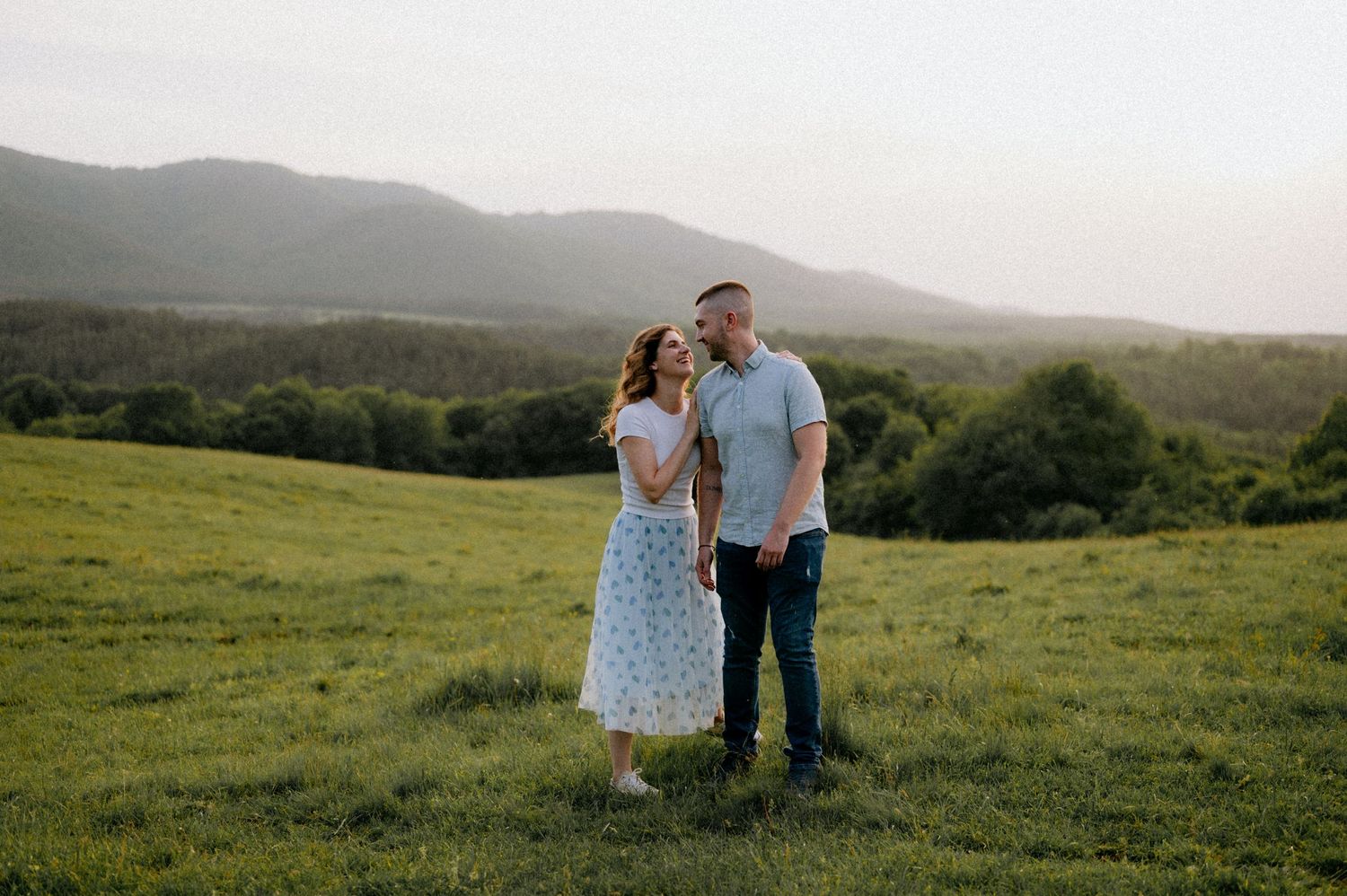 Couple spending time together in a beautiful mountain landscape.