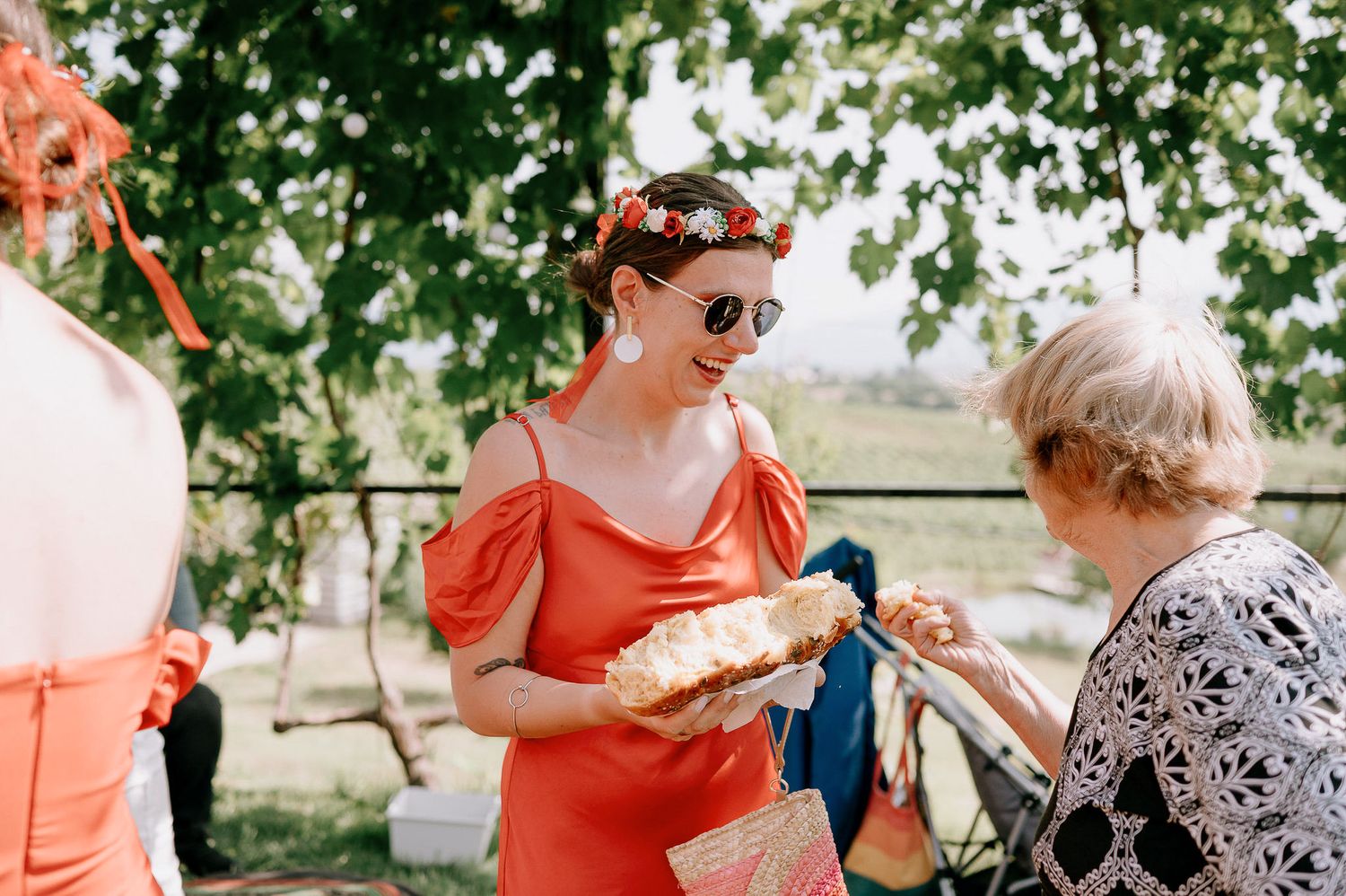 Guests mingling at an outdoor summer wedding reception.