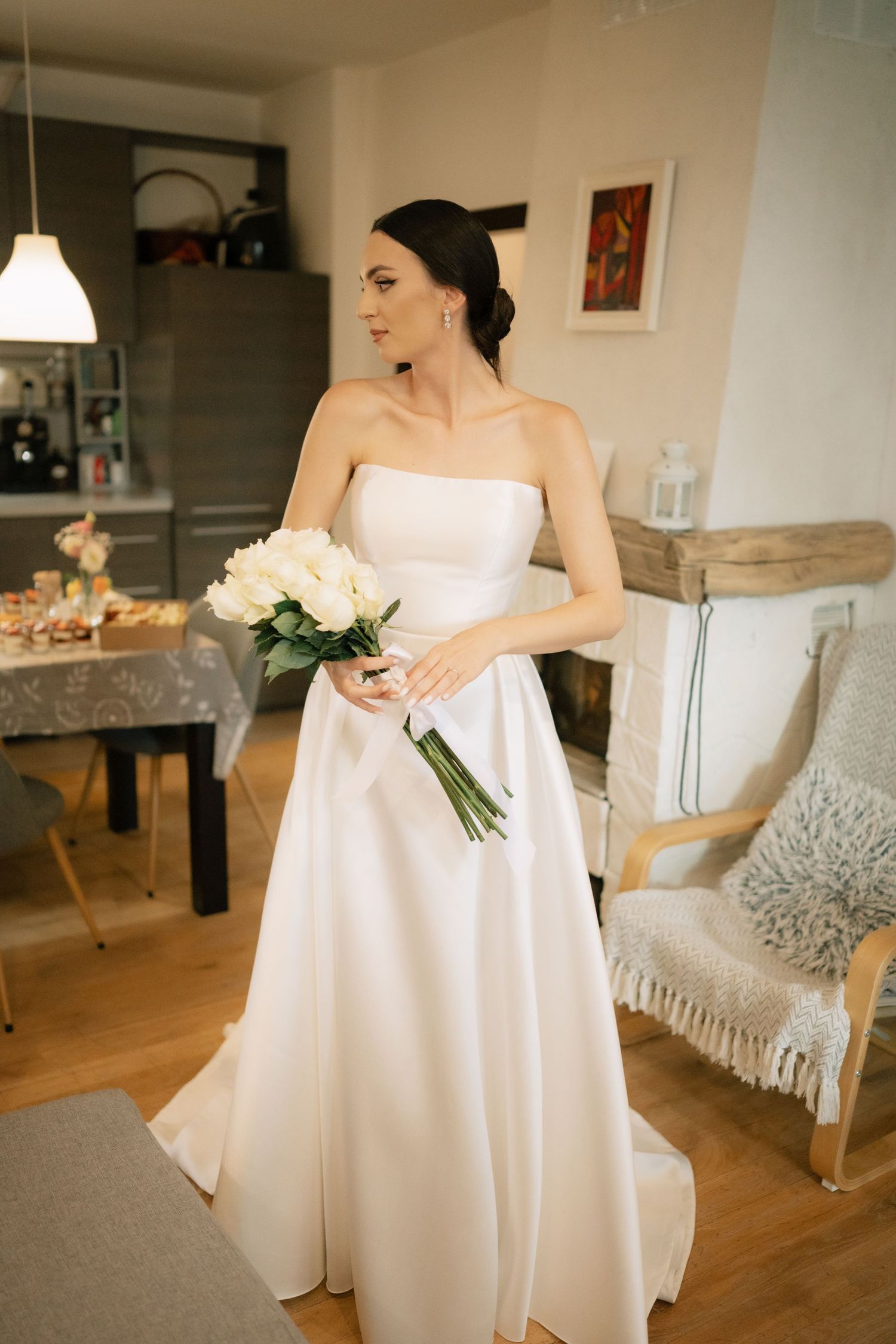 A series of photos showing a person in a flowing white wedding dress holding a small bouquet in an indoor setting.