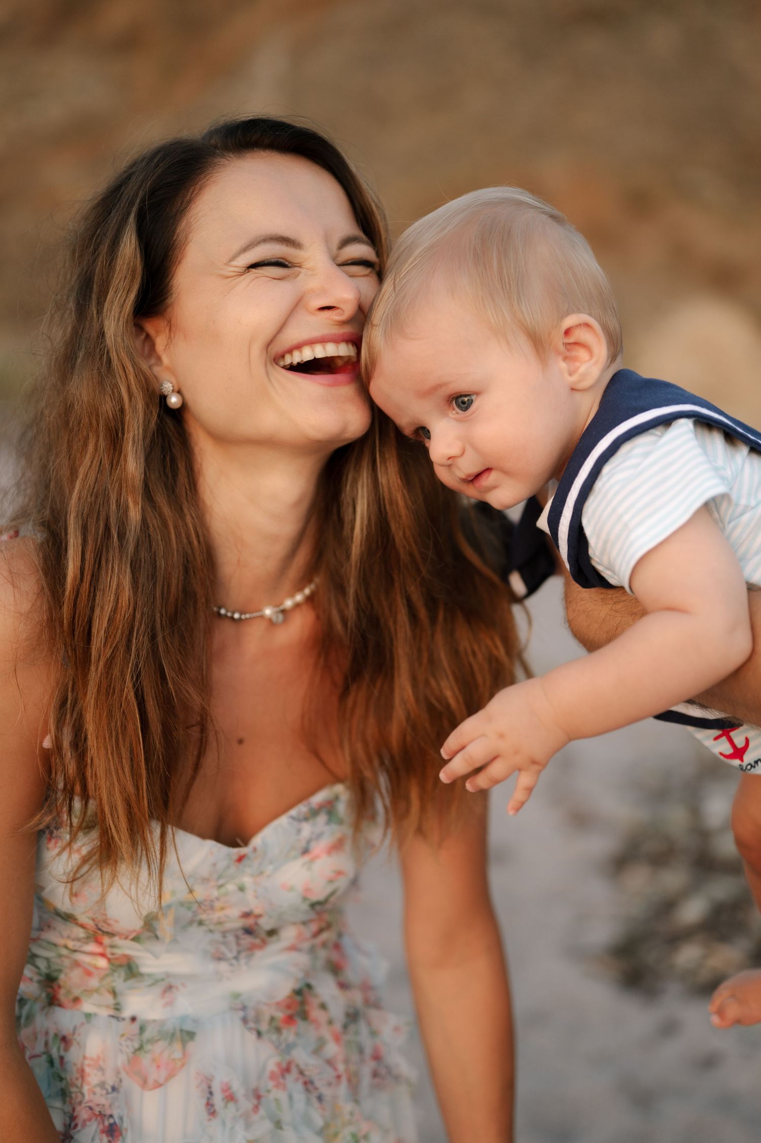 A mother and baby share joyful moments together in a series of candid photos showing their playful interaction.