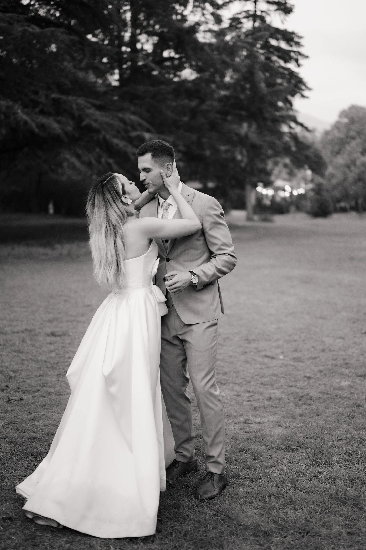 A romantic black and white wedding photo sequence shows a couple dancing together in an outdoor garden setting.
