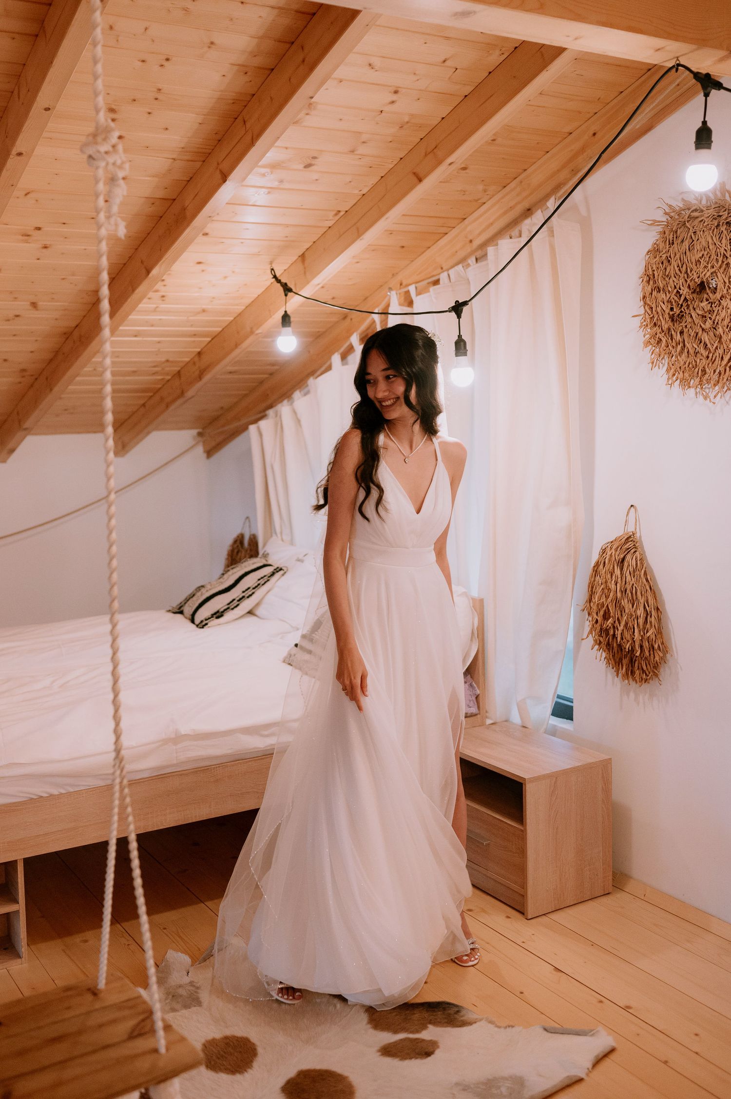 Elegant wedding photography in an attic space with rope swing and natural wood details.