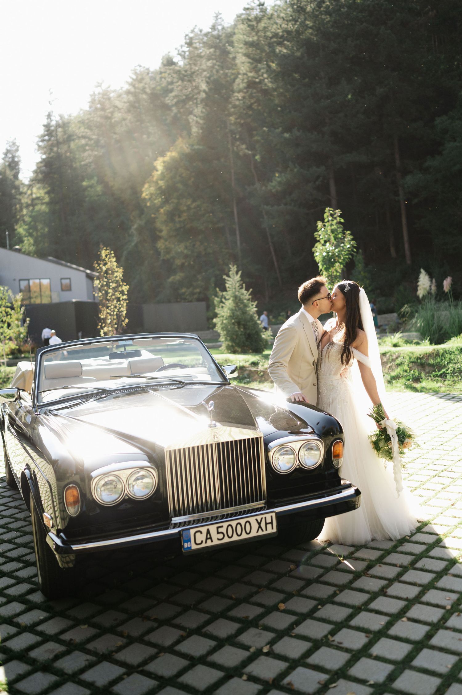 Vintage Rolls-Royce with license plate CA5000XH captured in golden afternoon light.