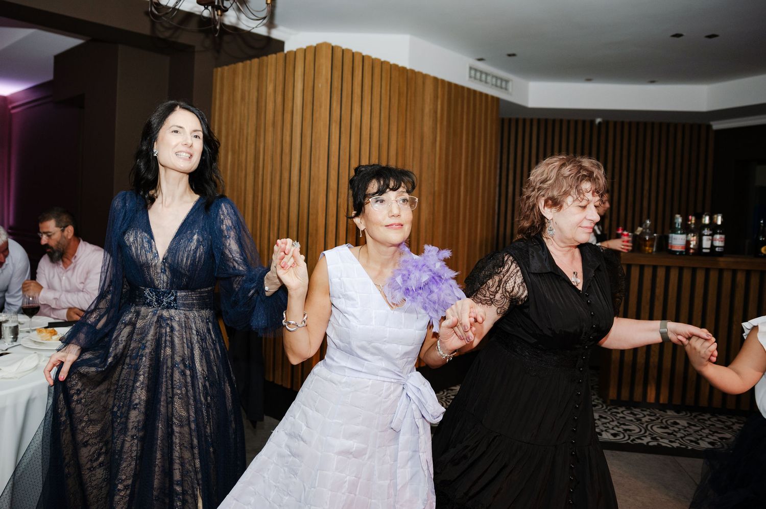 Wedding reception dance party with guests enjoying themselves on the dance floor.