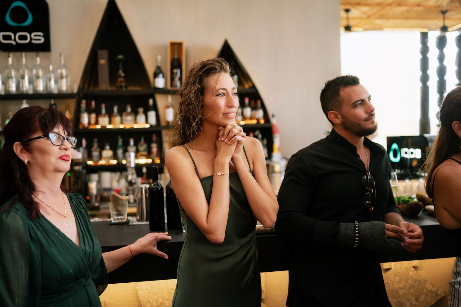 Candid moments of wedding guests during an indoor reception celebration.