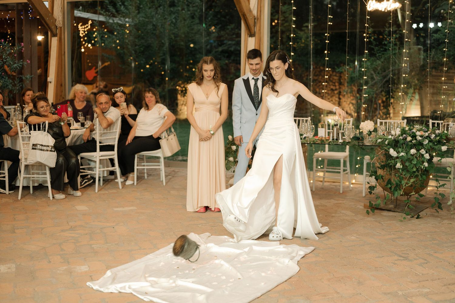 A sequence of wedding dance photos showing couples dancing in an elegant reception venue with twinkle lights.