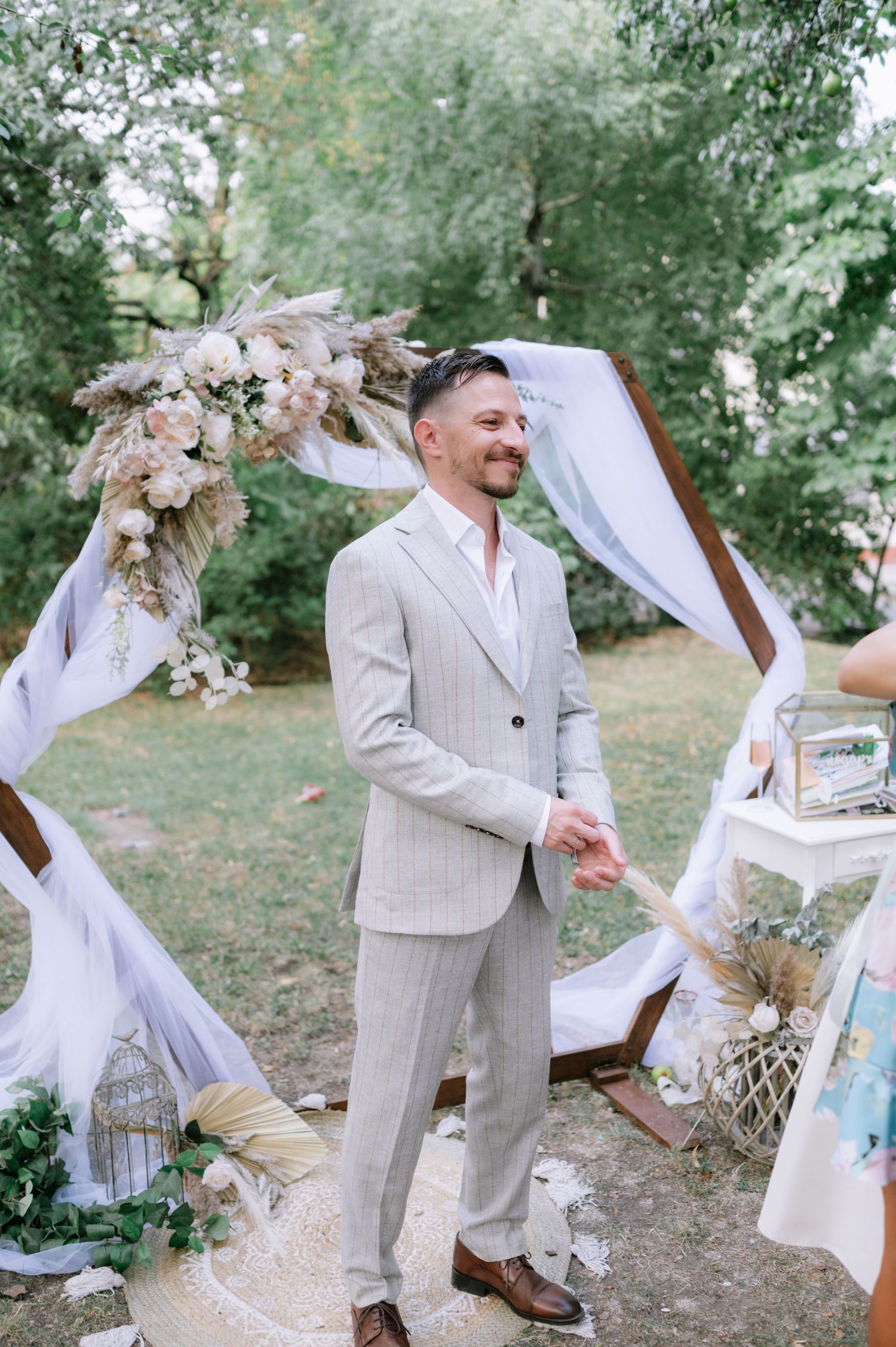 Playful outdoor wedding photo series showing couple dancing and twirling in a natural garden setting.