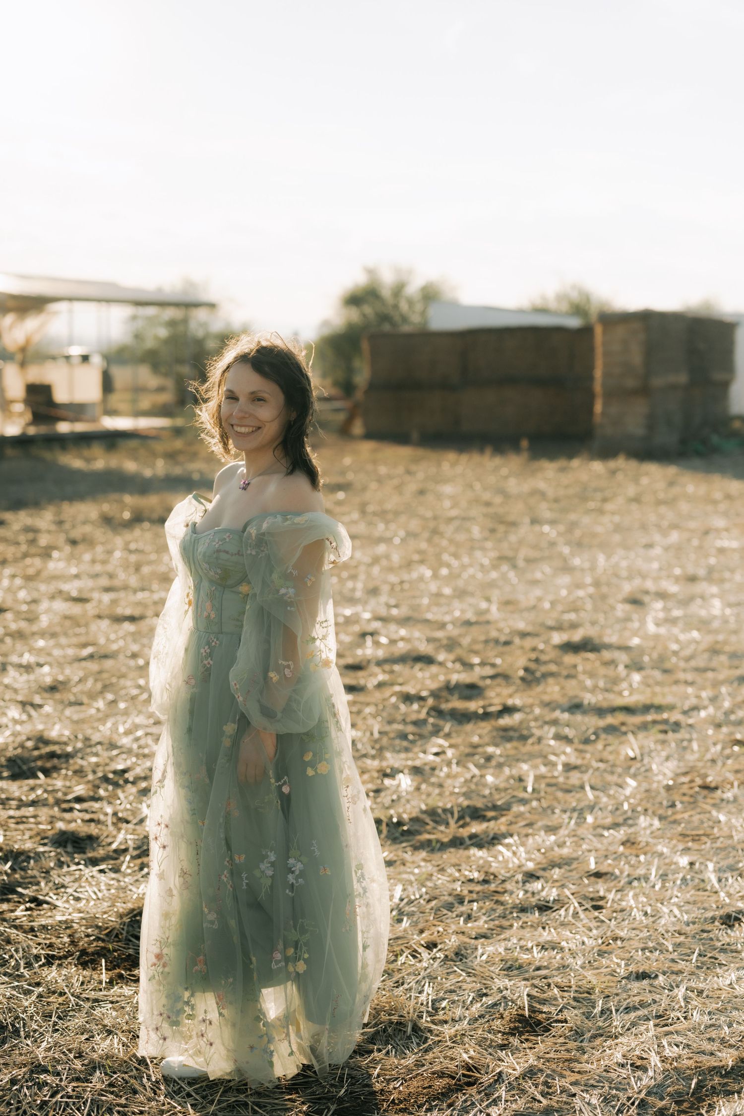 A series of vintage-style sepia photographs showing a small figure in a light dress standing in a dusty field.