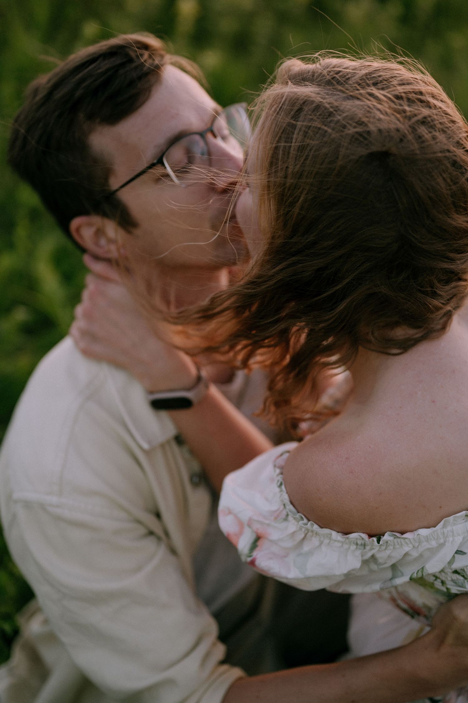 Intimate close-up of romantic moment in blooming wildflower field.