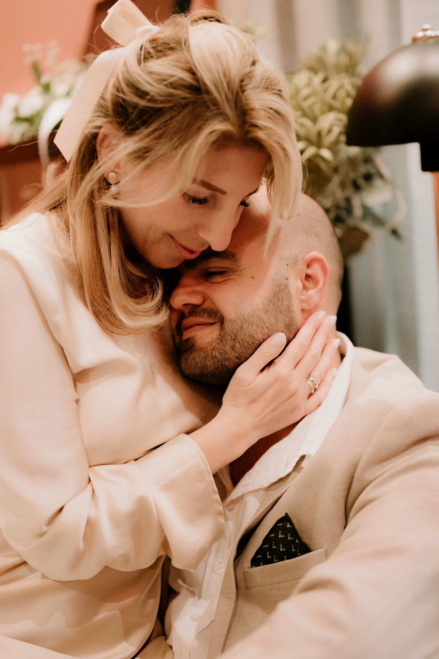 A series of candid romantic moments captured between two people in light-colored clothing.