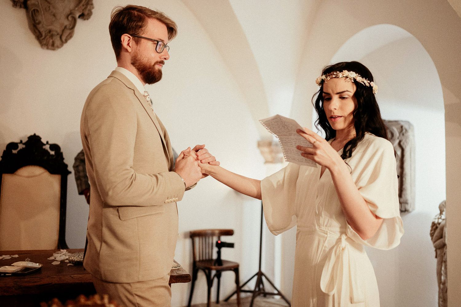 A romantic dance sequence captured in a bright white room with elegant decor.