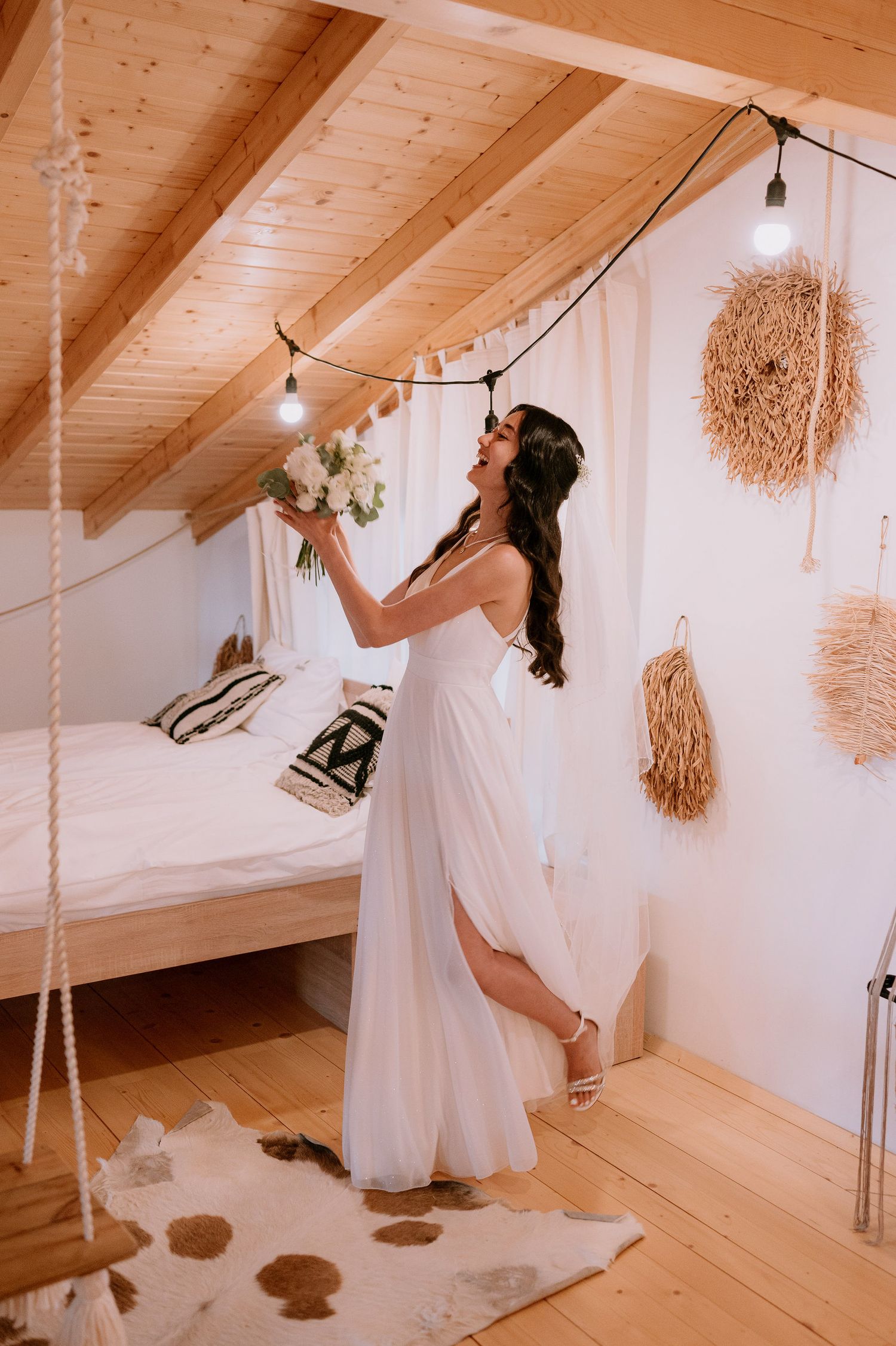 Artistic bridal photos featuring flowing white dress and rustic rope swing decorations.