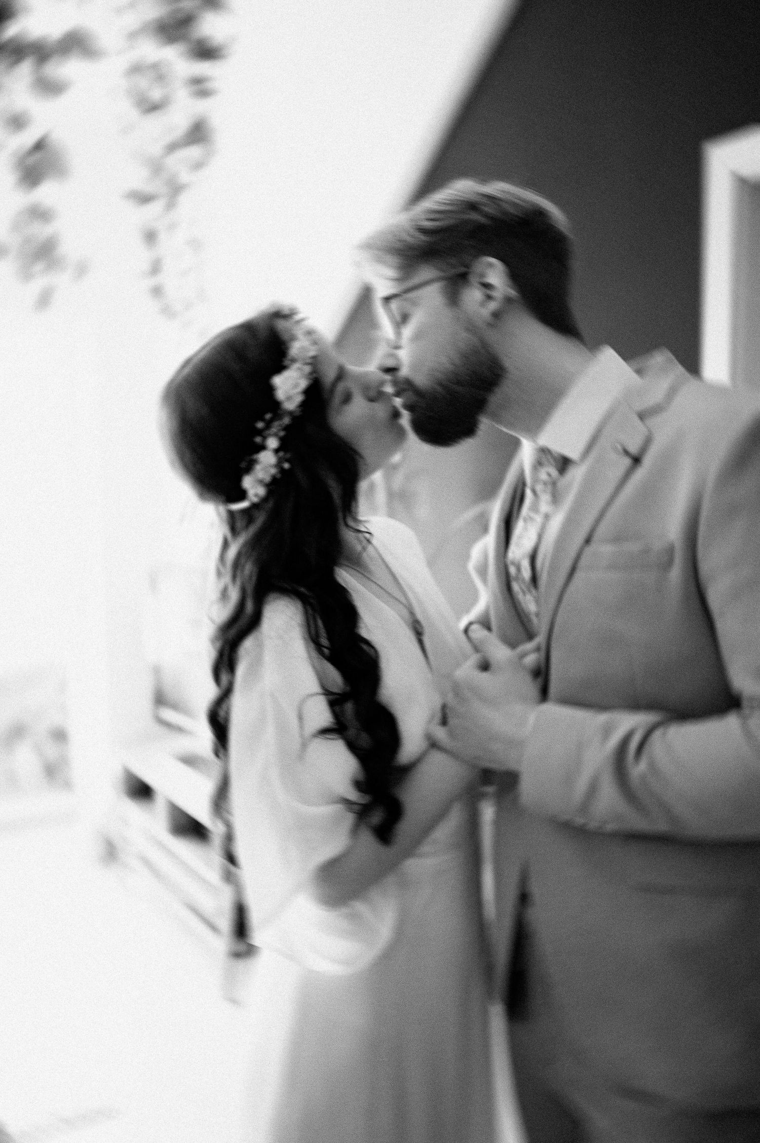 Black and white artistic wedding photos showing romantic dance poses.