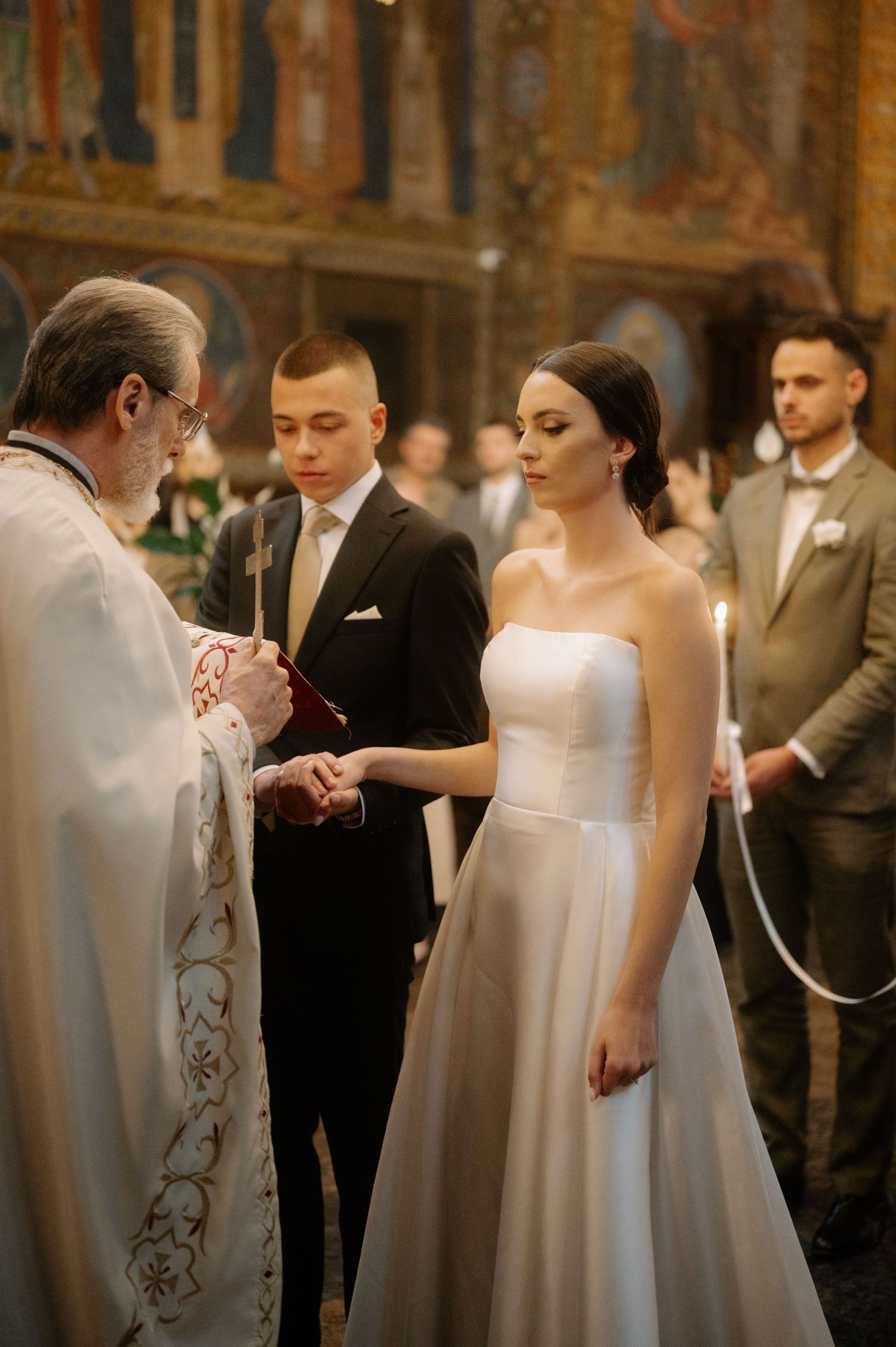 A series of wedding ceremony photos showing intimate moments between couples exchanging rings in formal attire.