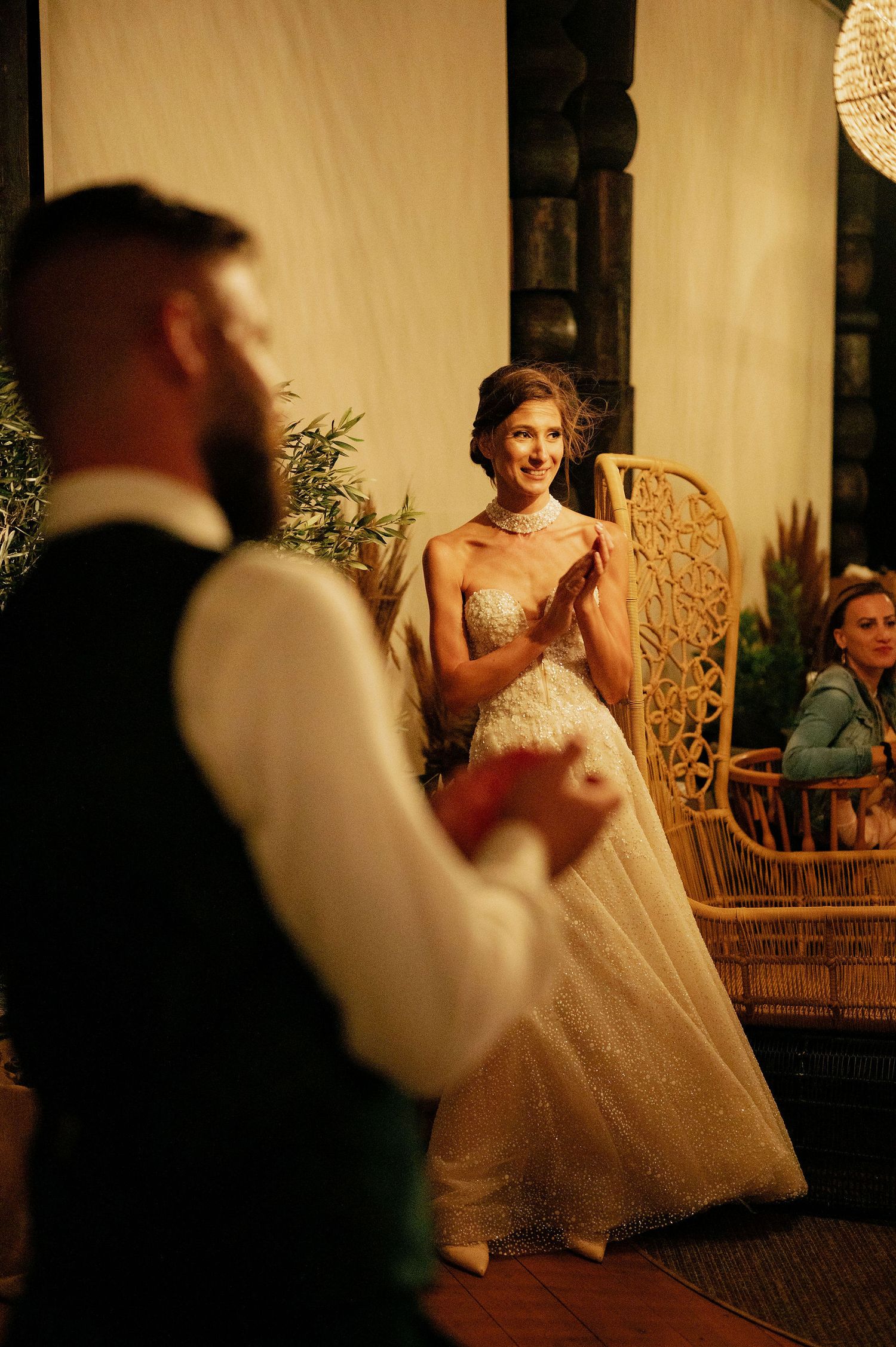 Wedding celebration with dancers twirling under vintage-style pendant lights.