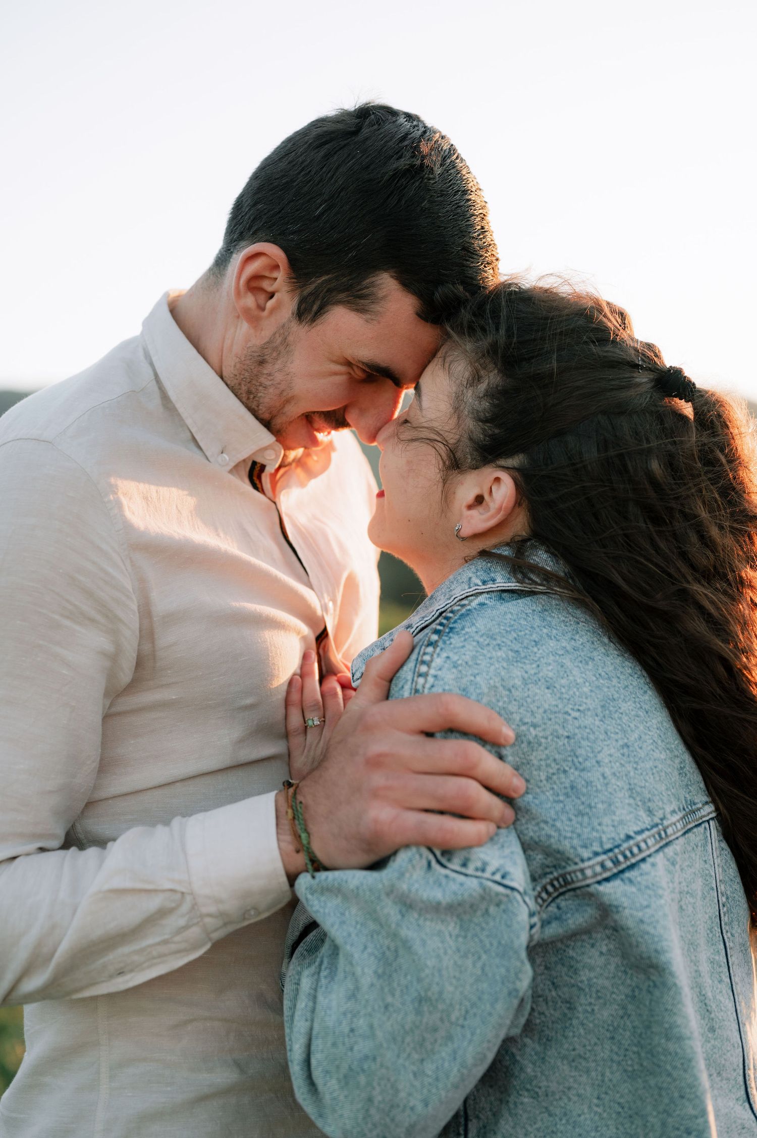 A couple sharing an intimate moment in a series of three romantic photos showing them embracing and kissing.