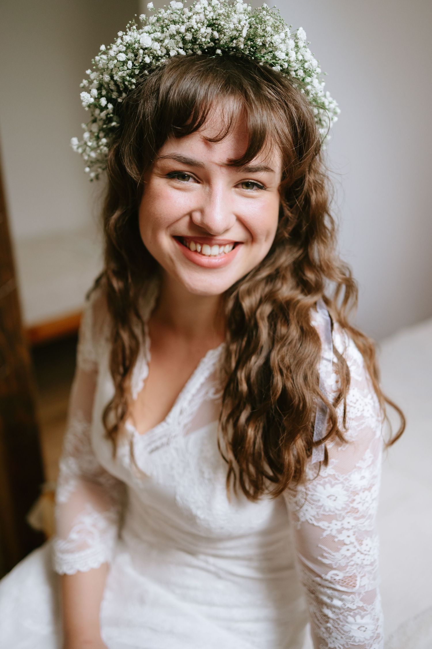 Bridal portrait series featuring a vintage-inspired lace dress and delicate baby's breath crown.