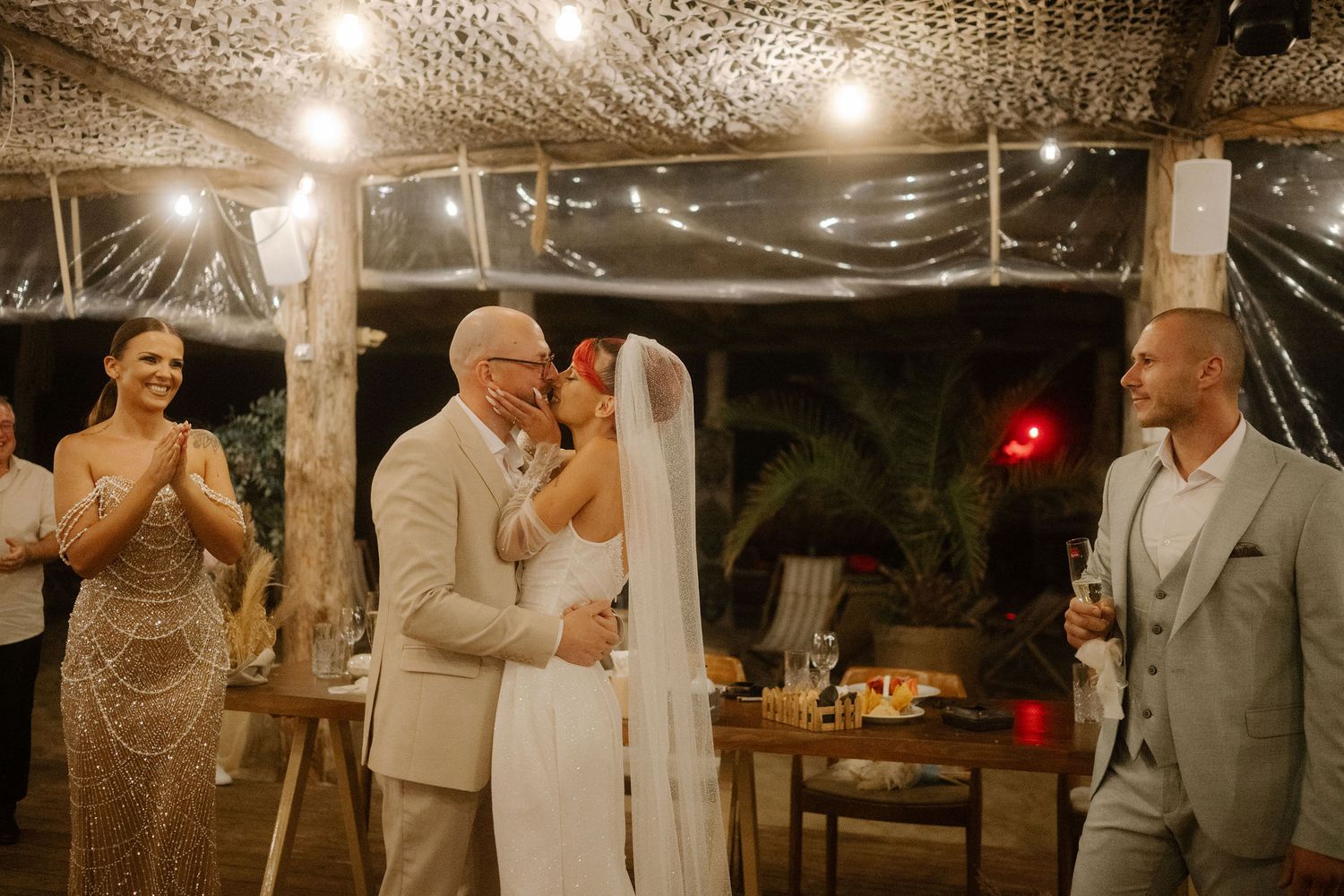 A romantic wedding celebration montage showing tender moments between a couple during their special evening ceremony.