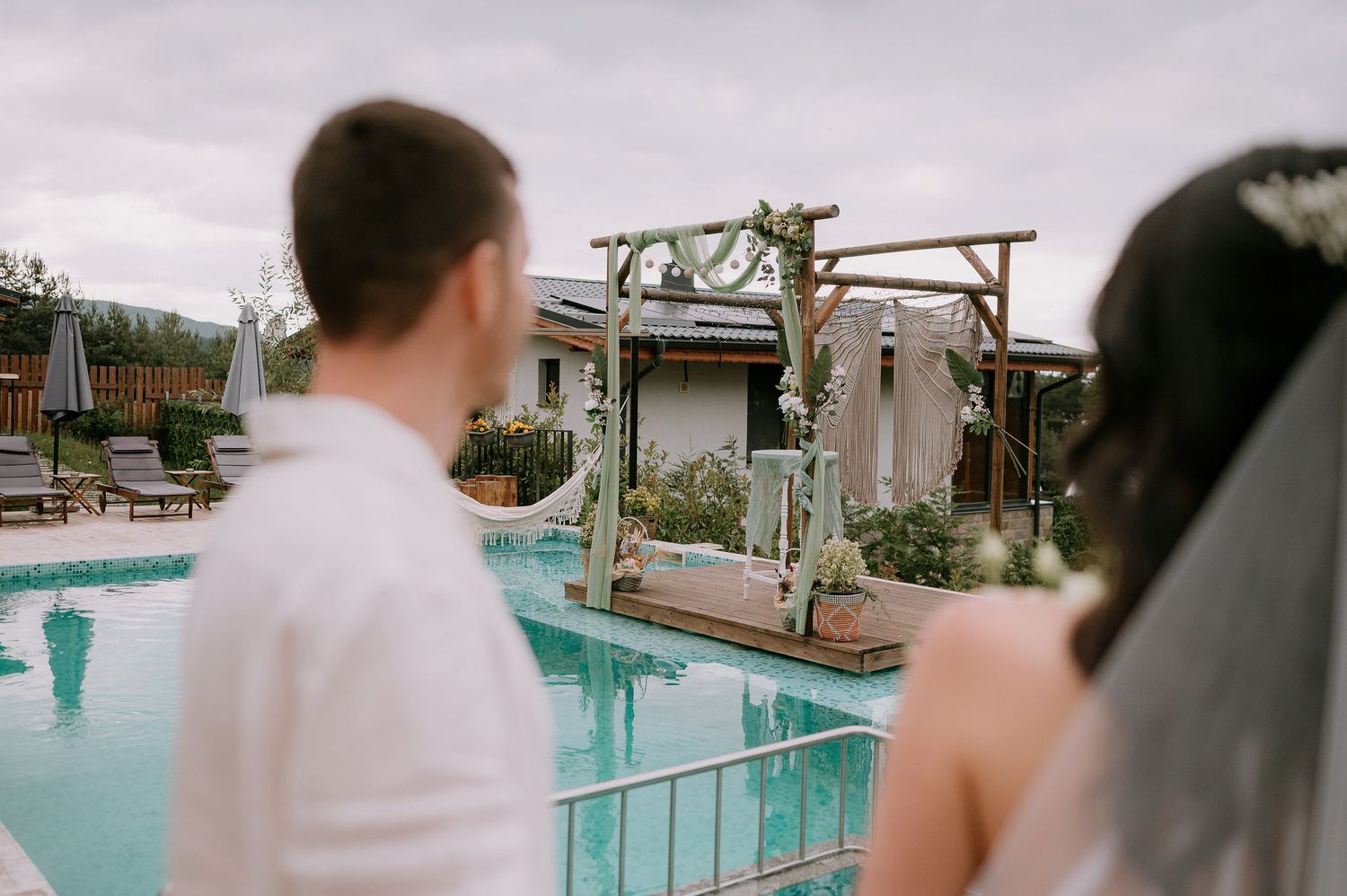 Blurred candid moments captured during an outdoor poolside event.