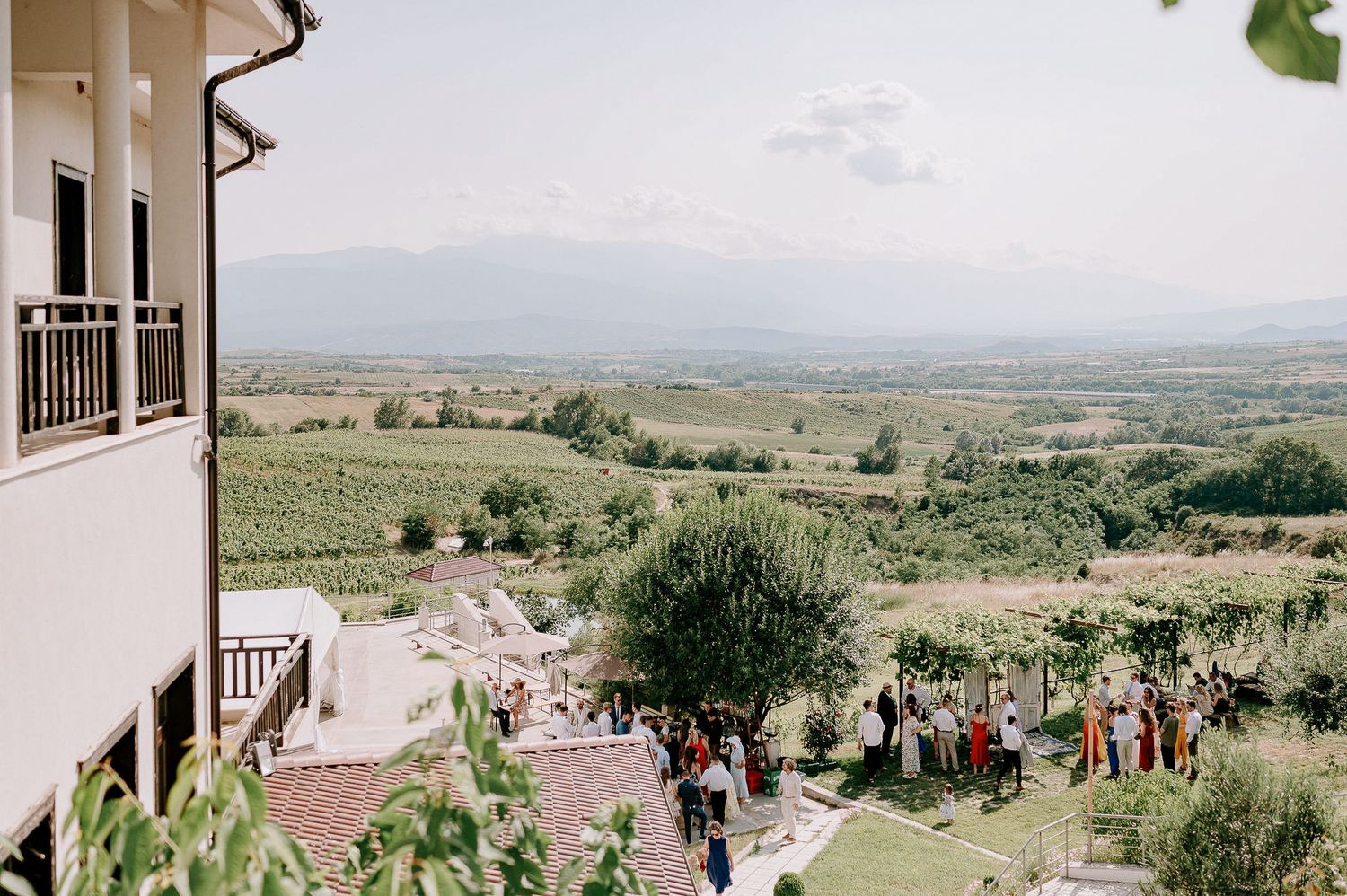 Panoramic view of rolling hills and countryside landscape from a hilltop venue.