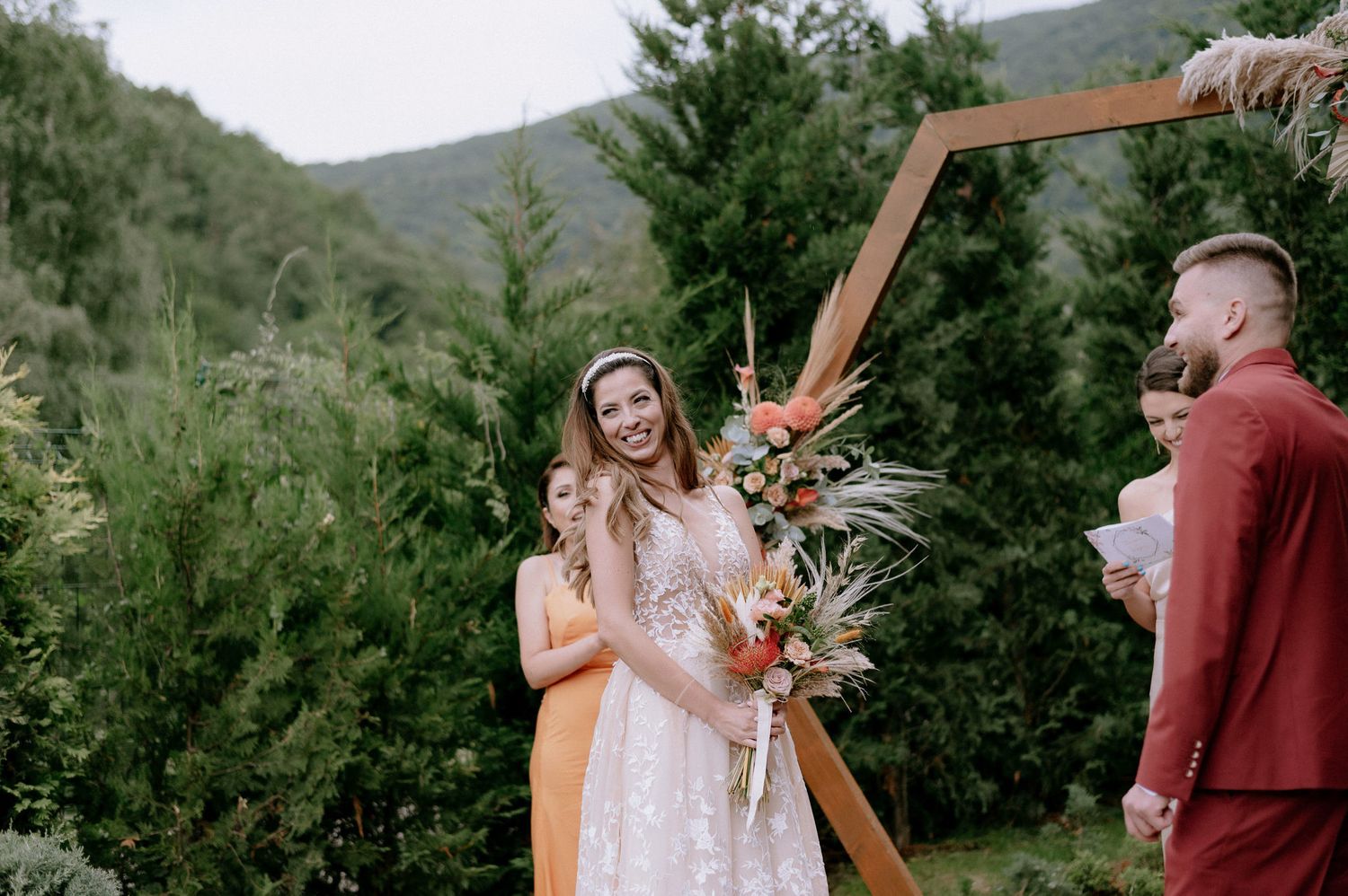 A series of outdoor wedding ceremony photos set against a mountainous backdrop with evergreen trees.