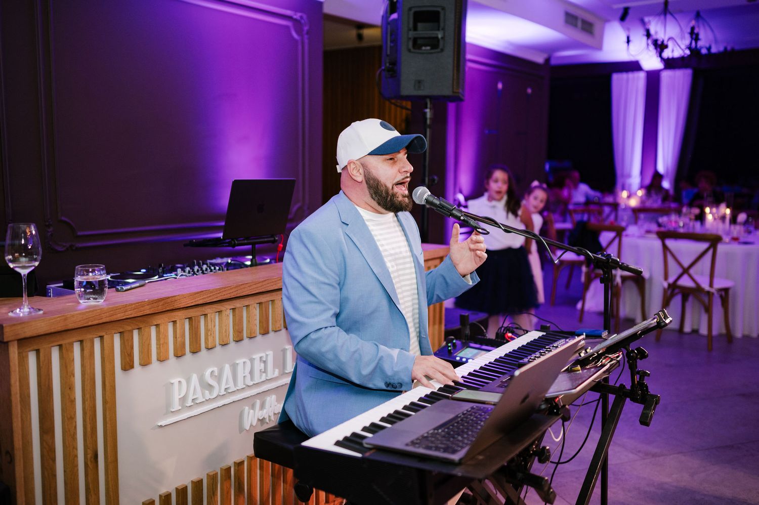 Entertainment setup with purple mood lighting at wedding reception venue.