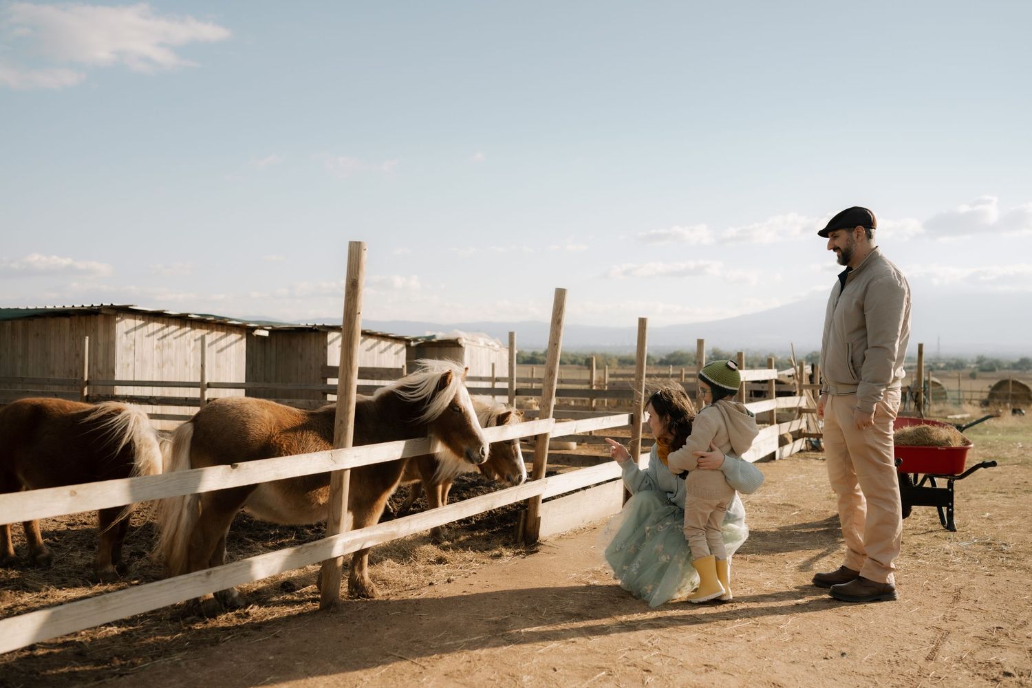 A panoramic view of a desert landscape with wooden fences and structures stretching across the horizon.