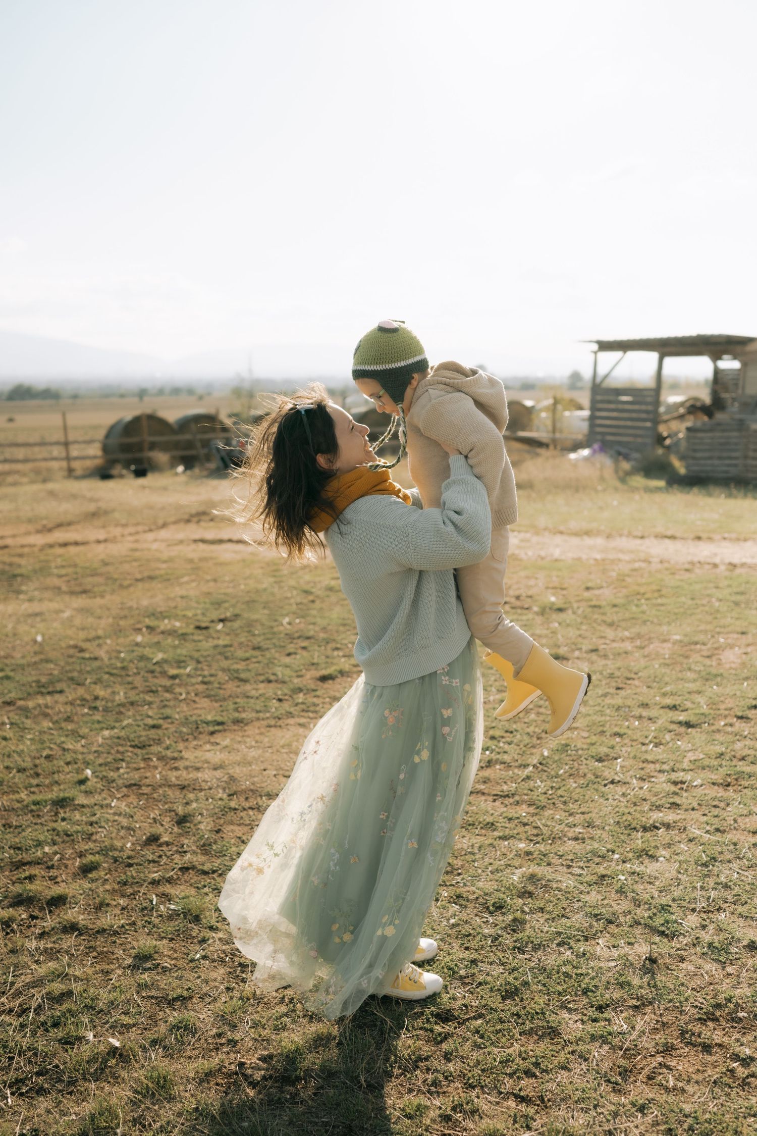 A sequence of romantic dance poses in a rustic outdoor setting shows a couple twirling in soft light.
