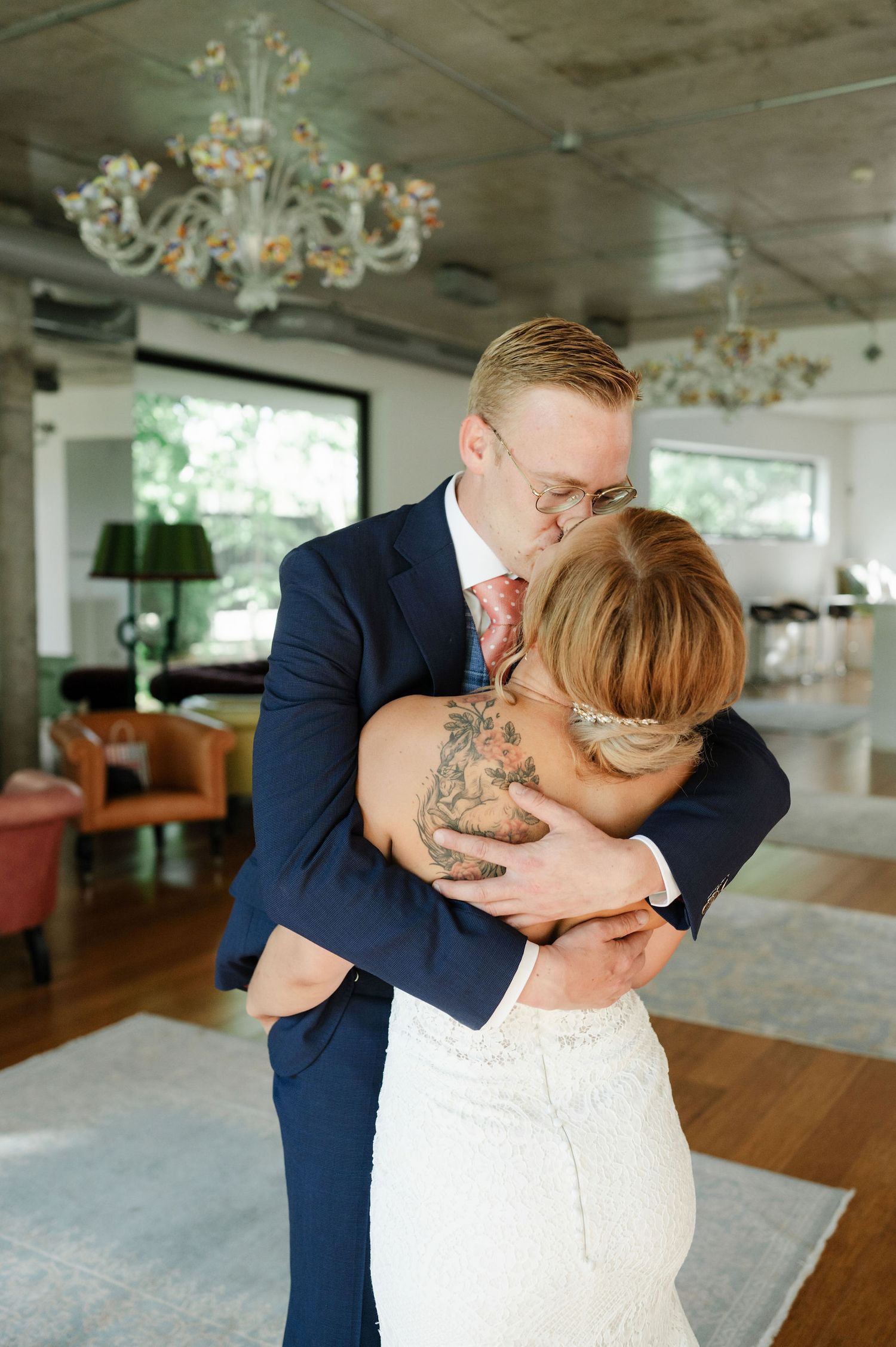 Intimate dance moment captured between newlyweds in an elegant reception space.