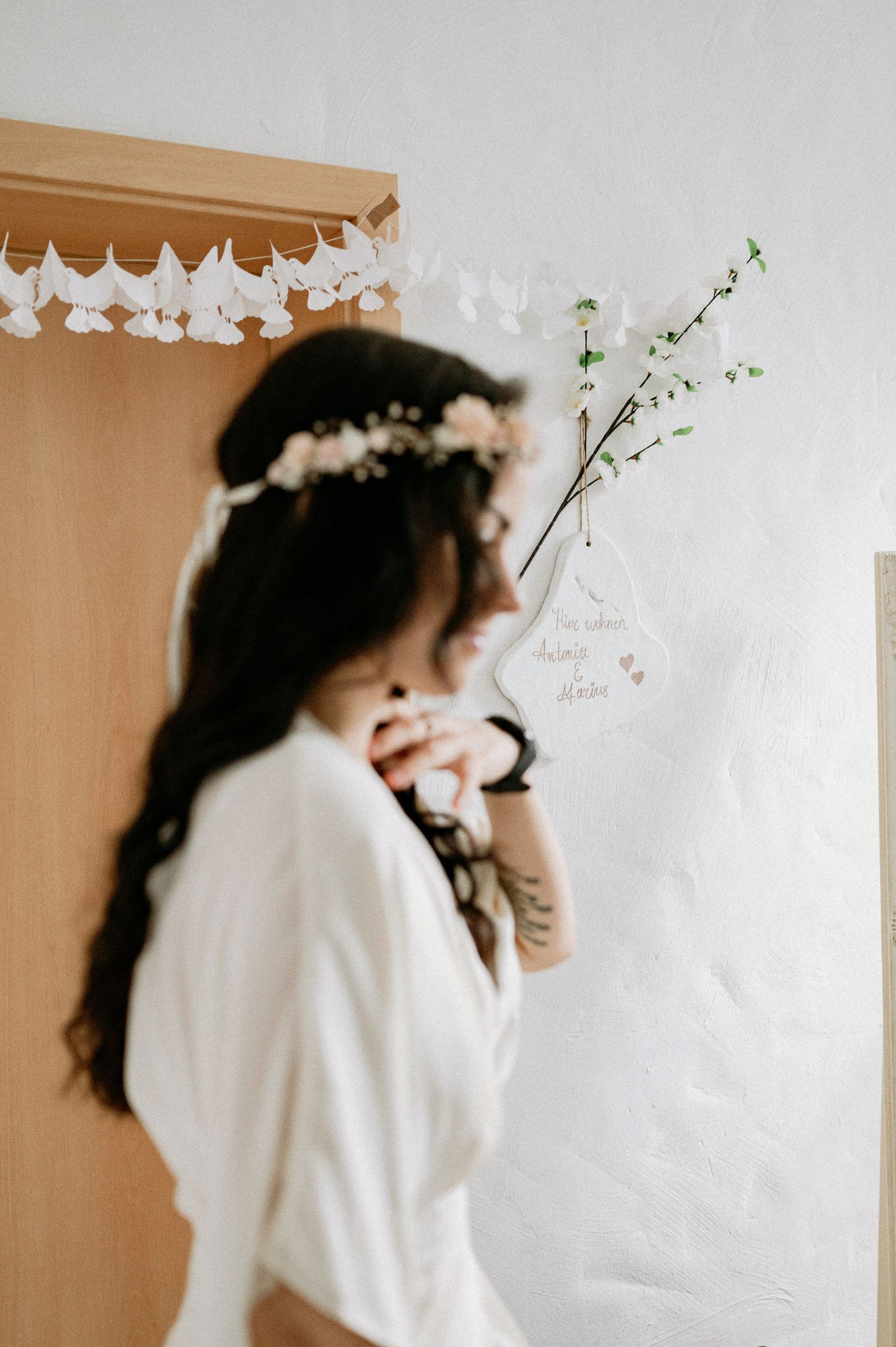 Ethereal bridal portraits with delicate white flowers and soft natural lighting create a dreamy atmosphere.