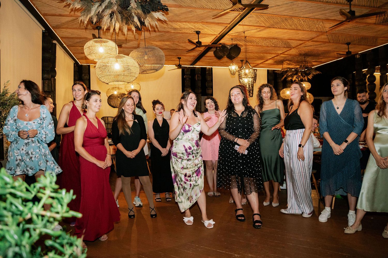 Group of wedding guests gathered for a special moment during the reception.