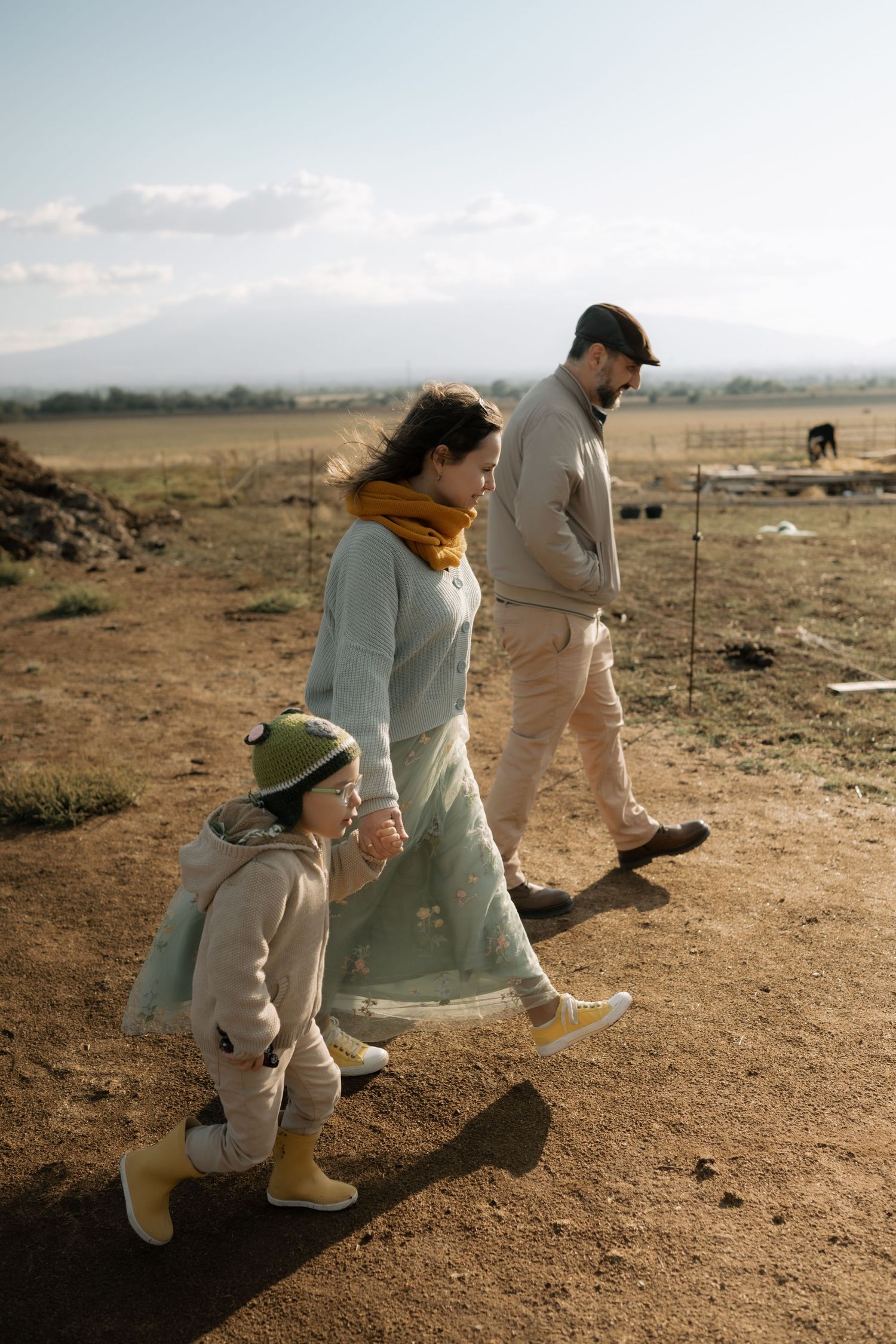 People walking together in a desert landscape on a sunny day.