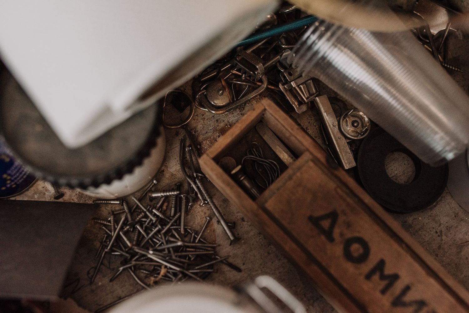 Close-up detail of antique typewriter mechanisms and keys in moody lighting.