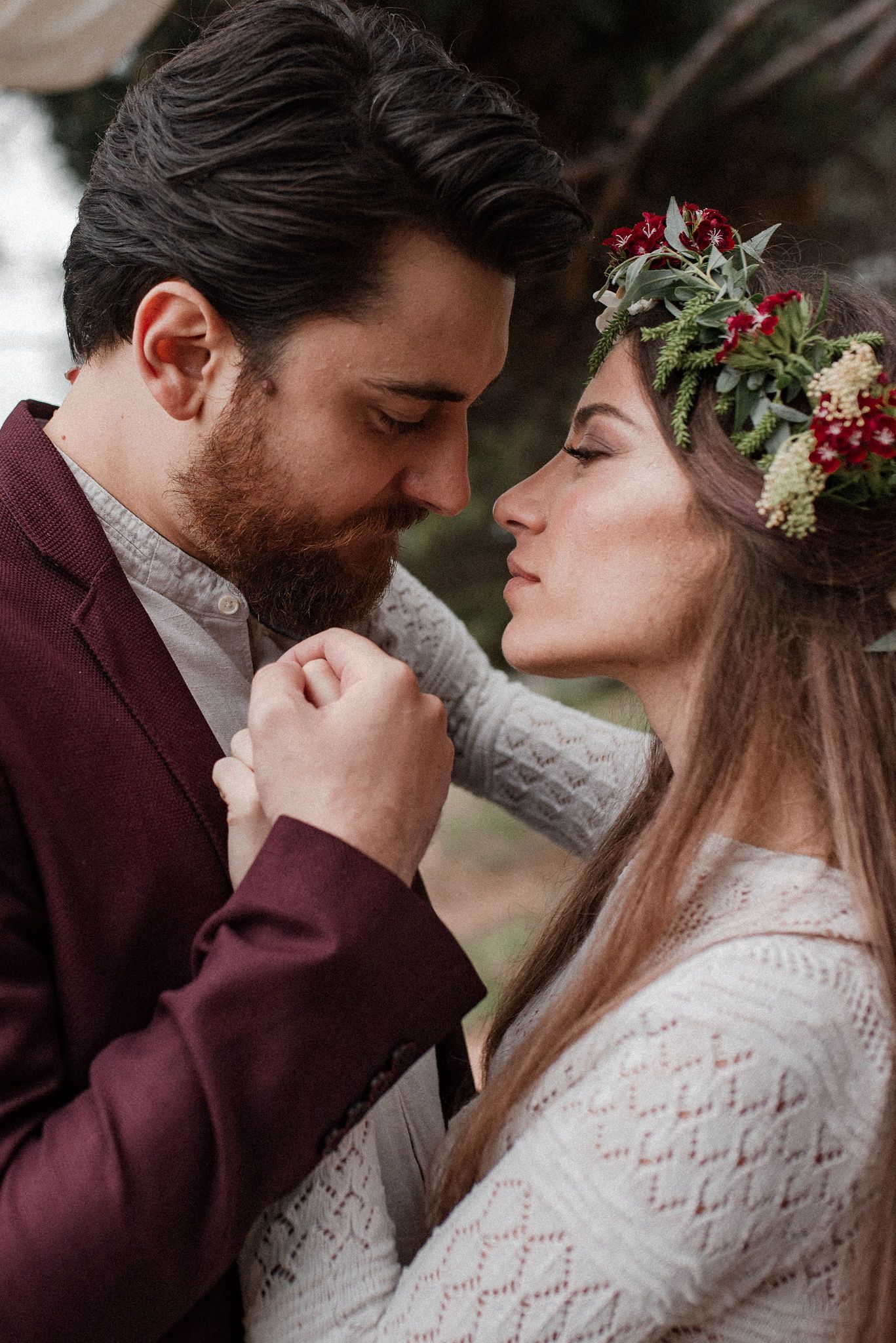 Romantic winter wedding couple in burgundy and white lace share intimate moments in a series of close-up photos.