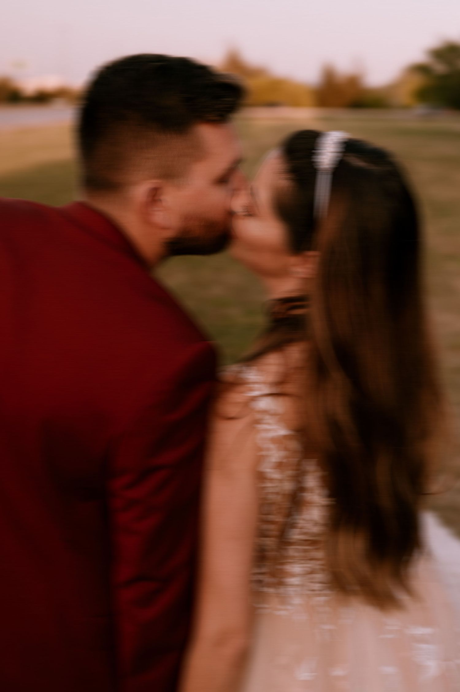 A romantic sunset portrait session showing tender moments between a couple in formal attire.