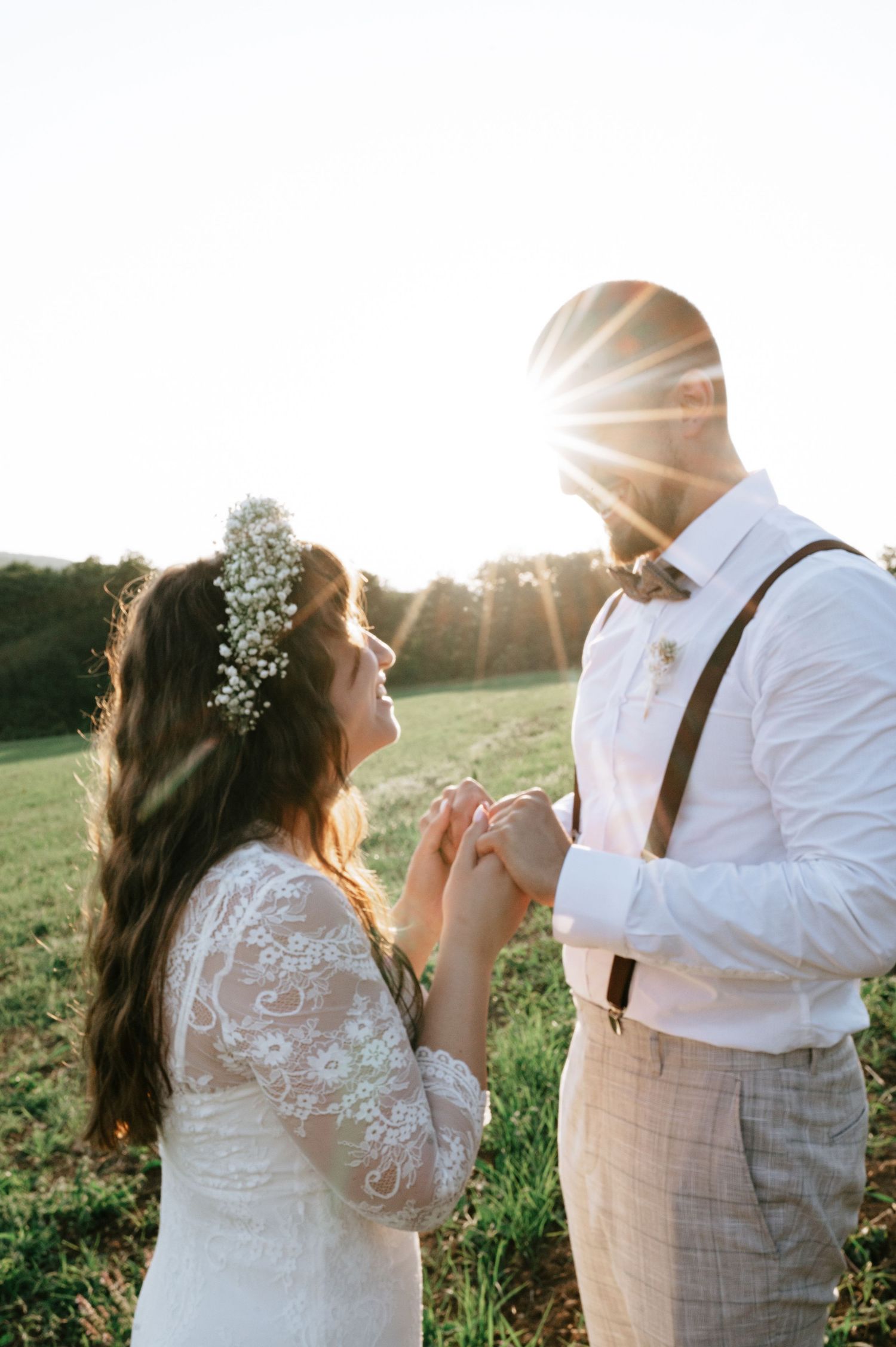 A couple shares a playful dance moment during their sunset wedding photoshoot.