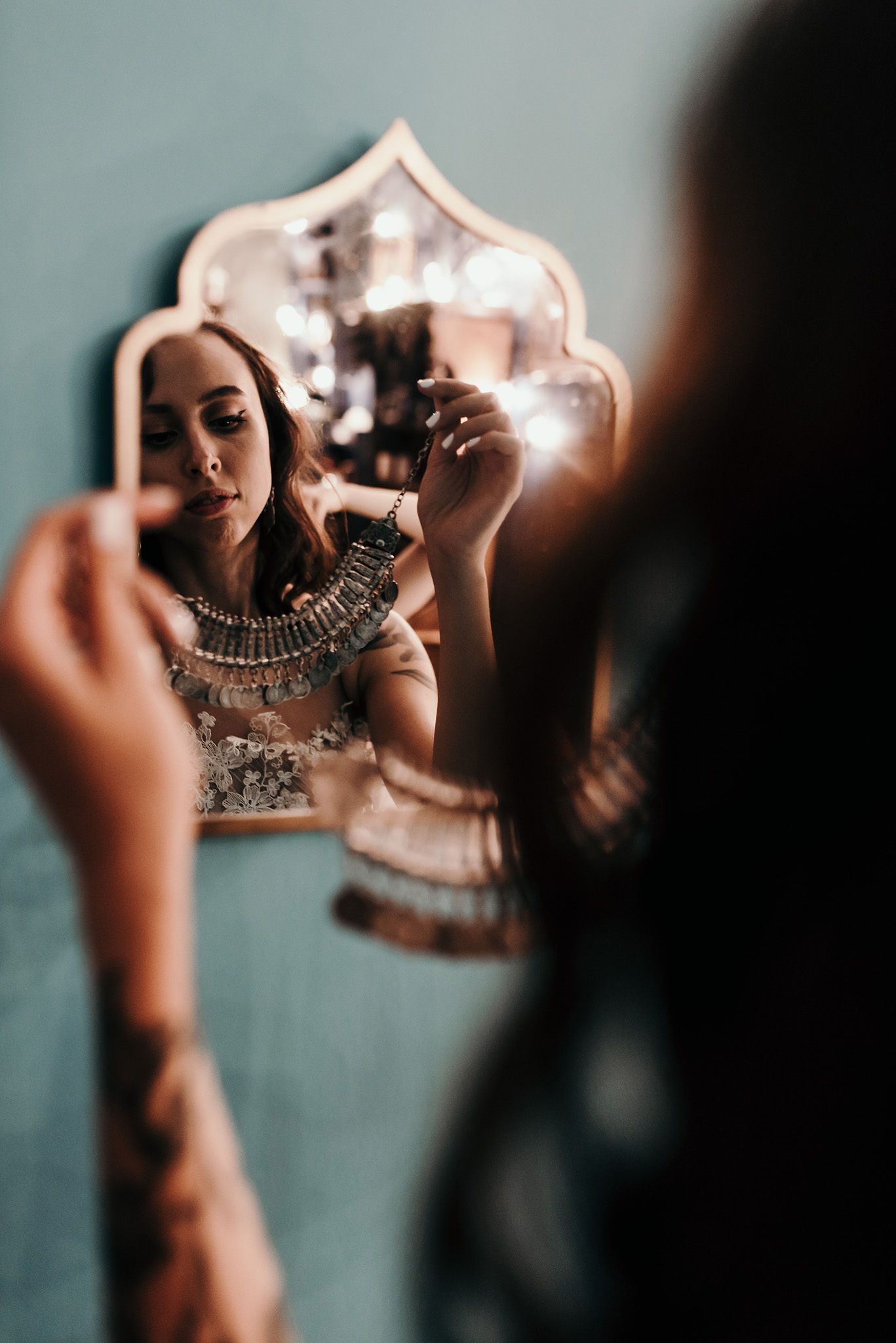 Detailed shots of an ornate vintage-style mirror reflection in atmospheric lighting.