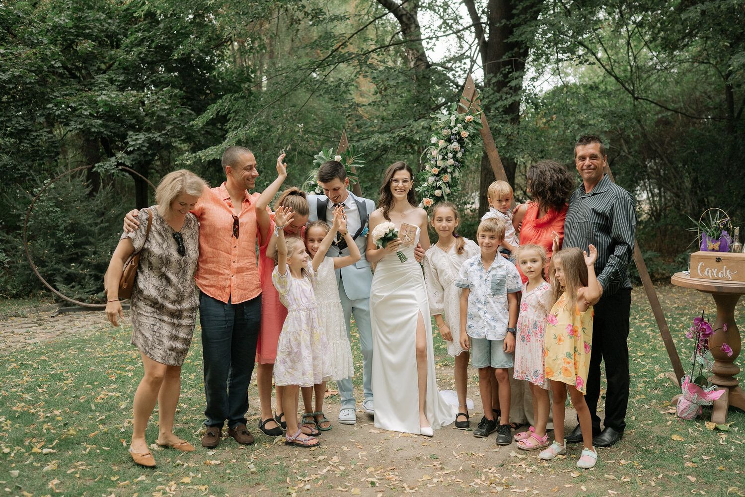 A sequence of wedding party photos taken outdoors in a garden setting showing joyful celebration moments.