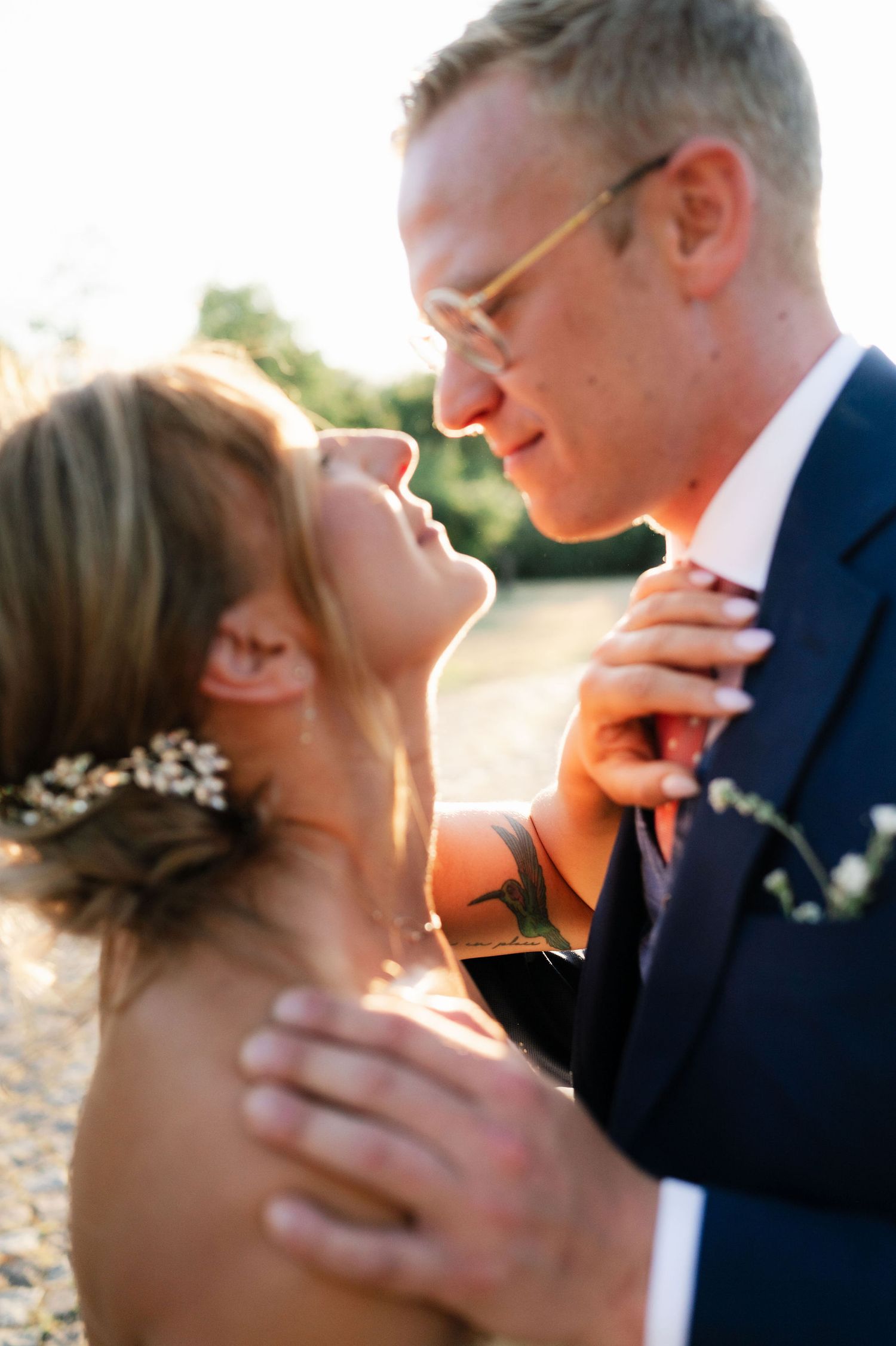 Wedding couple shares intimate moments in series of artistic sunset photographs.