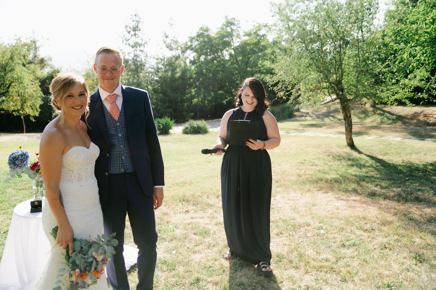Wedding ceremony moments captured in sequence on a sunny day in a natural outdoor setting.
