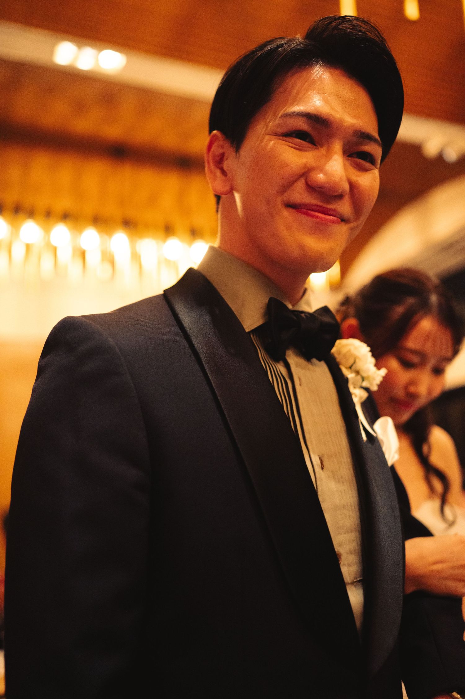 Candid reception moments captured with warm lighting and elegant decor.