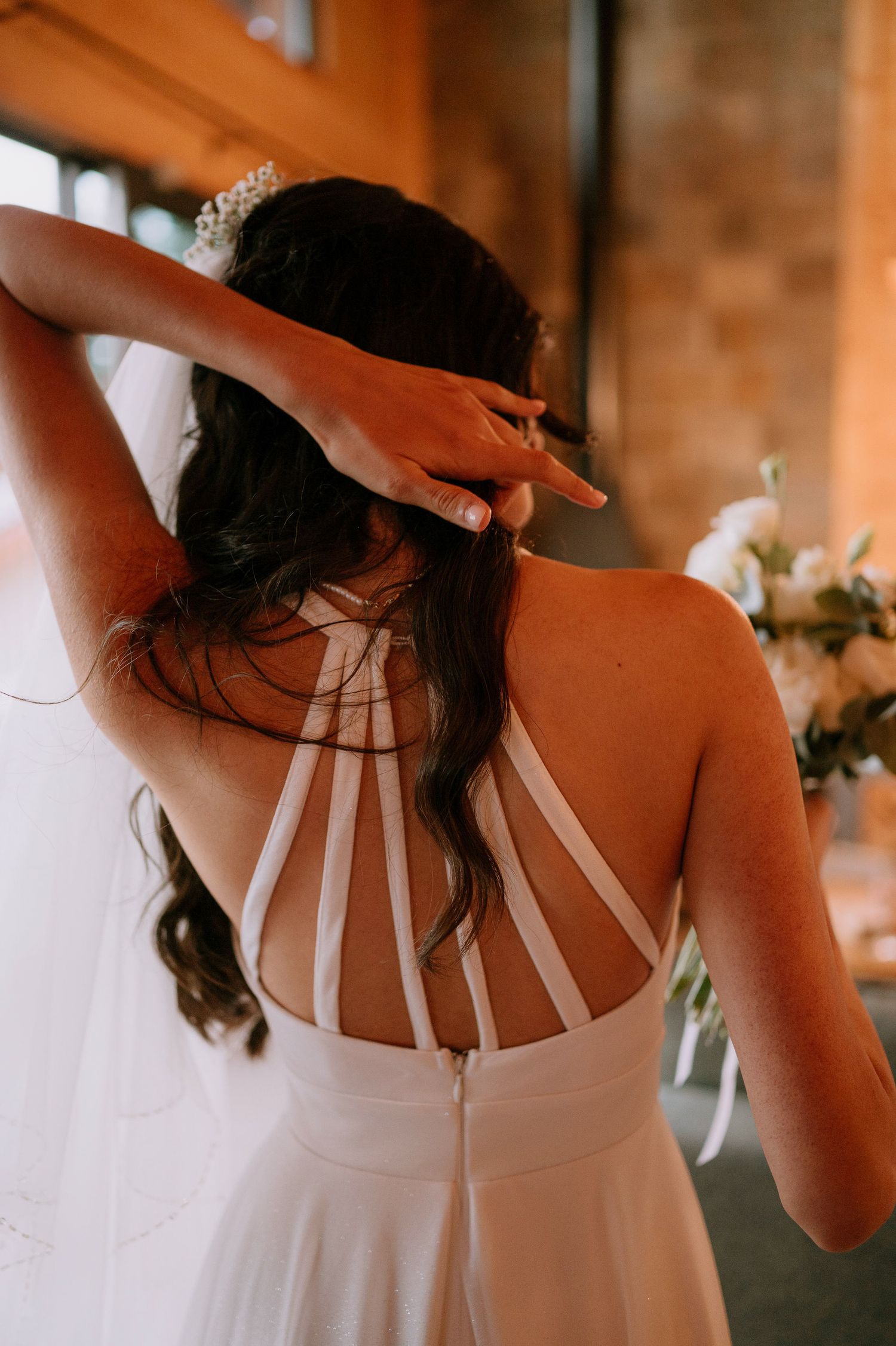 Series of photos showing intricate back strap details of a white wedding gown.