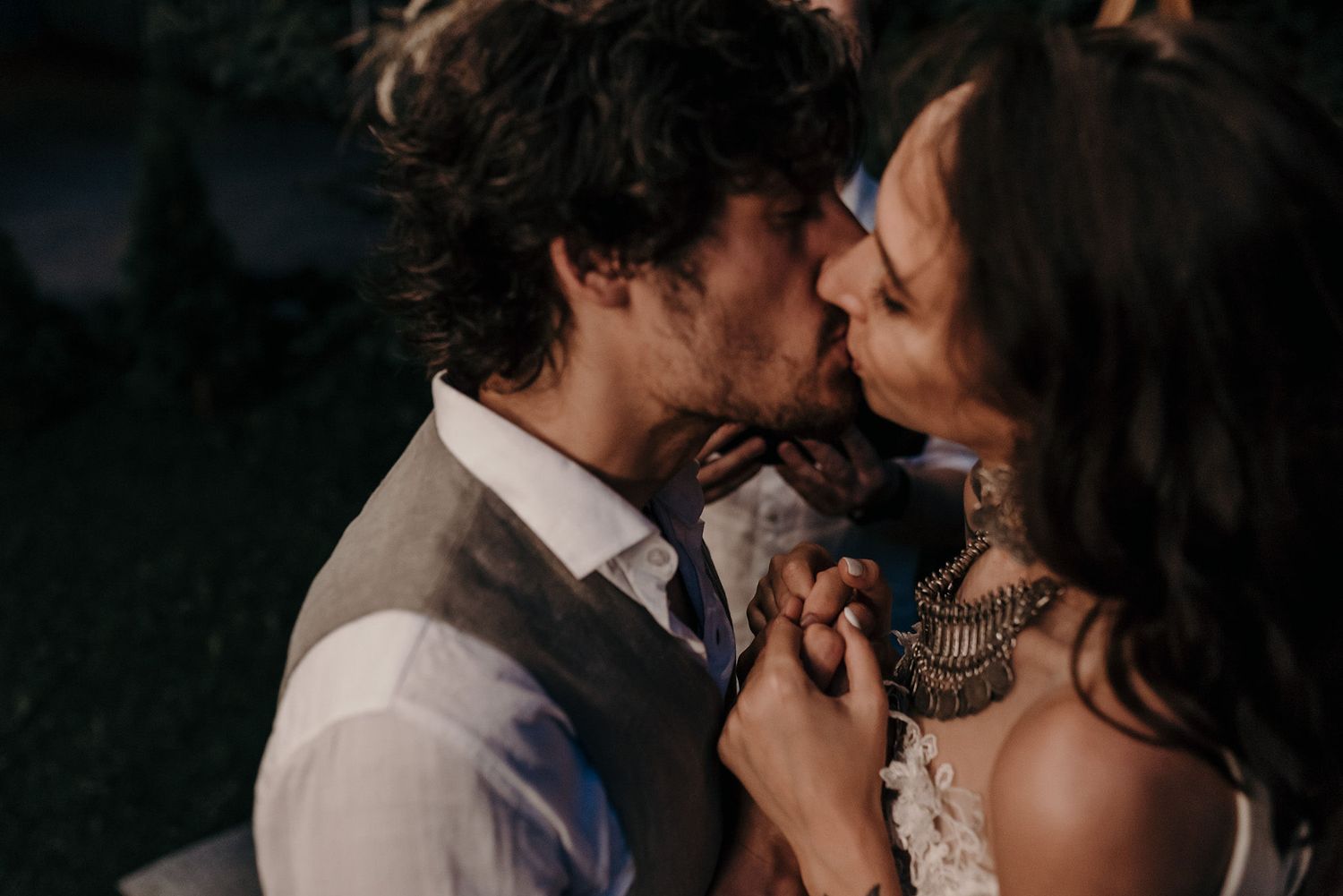 A romantic series of black and white wedding photos showing intimate moments between a couple during their celebration.