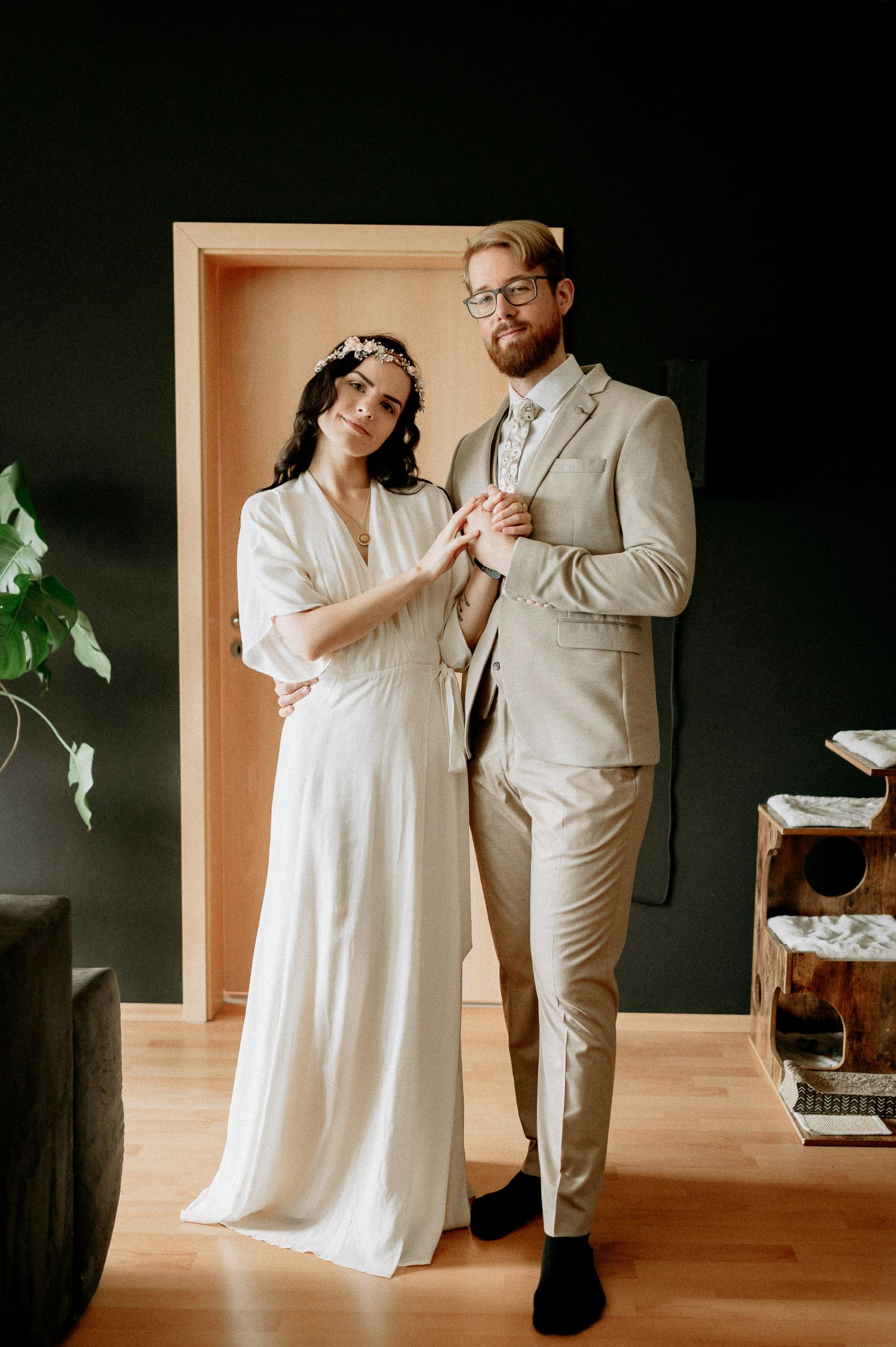 Intimate wedding dance captured in a modern minimalist setting with natural lighting.